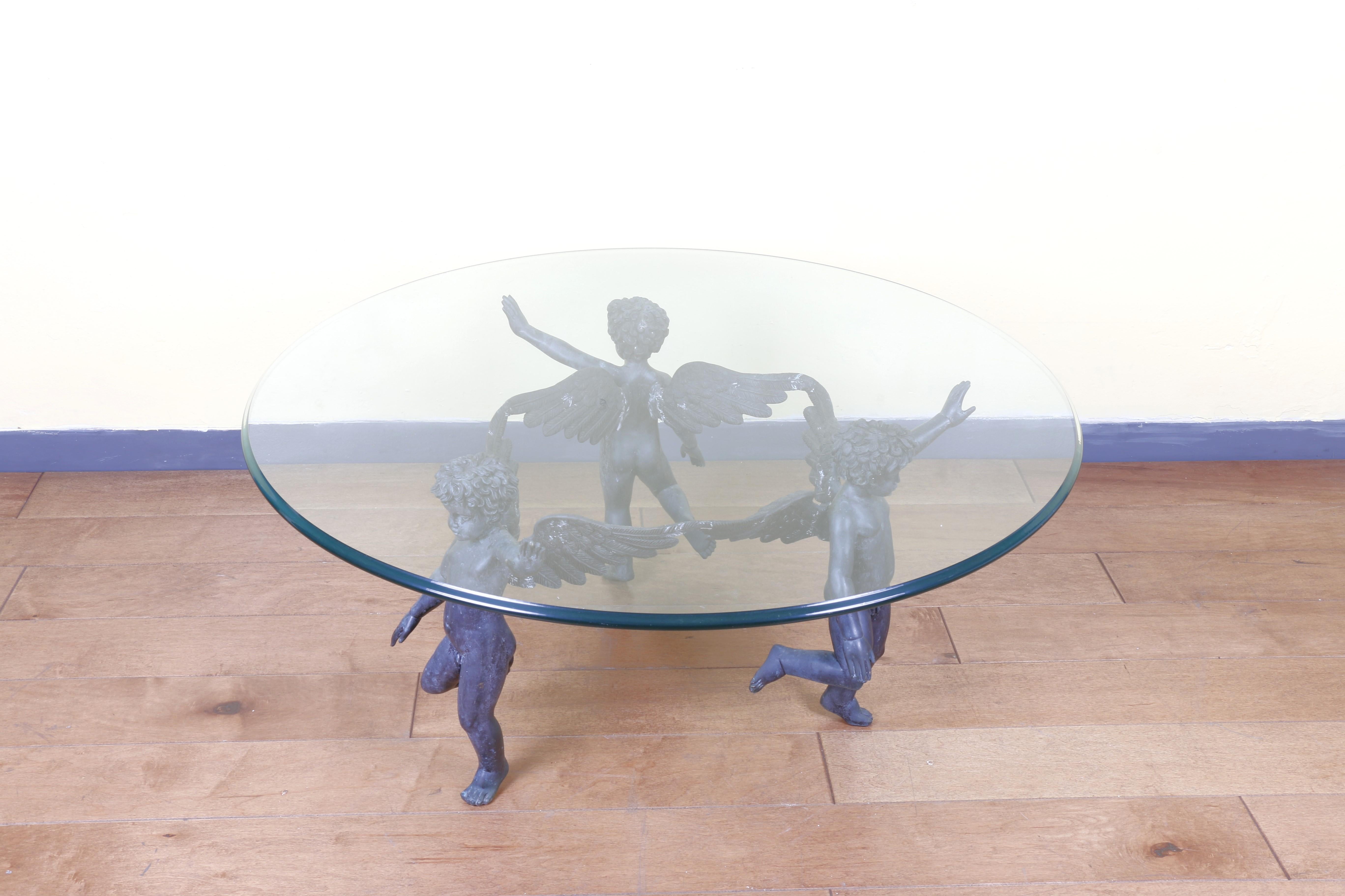 Great Bronze Dancing Cherubs coffee table with original patina. Very well made with many details. This beautiful bronze table comes with a glass top. No chips or scratches. Excellent for any living room.