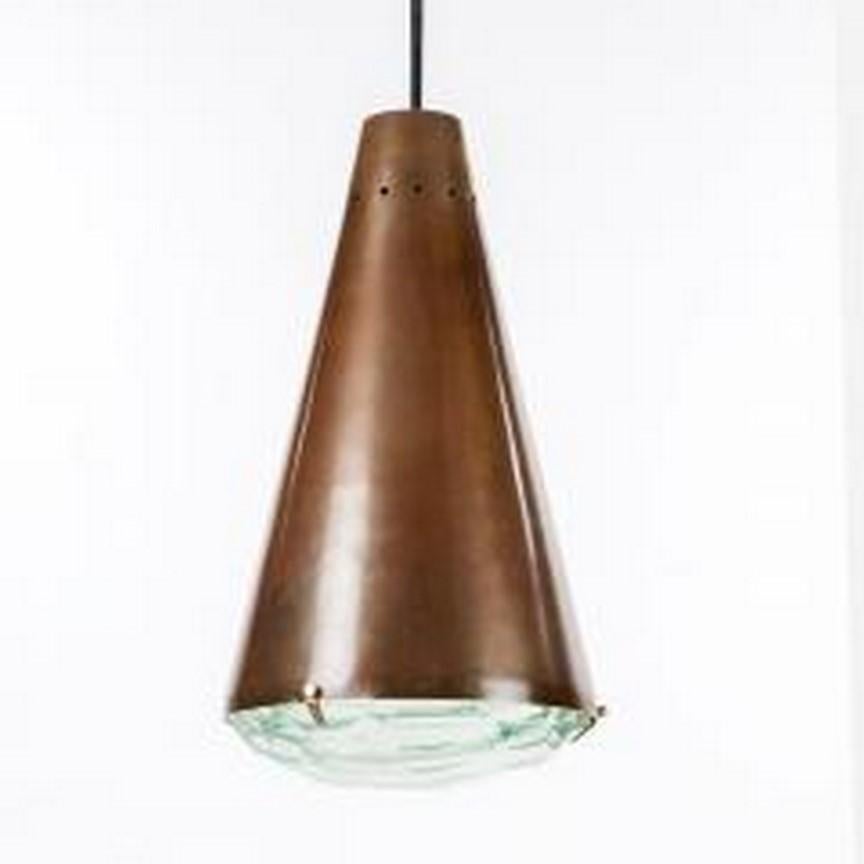 Bronzed metal and crystal pendant lamp Model  1995   designed by Max Ingrand for Fontana Arte, Italy,  circa 1960. This quality but simple stylish pendant would be ideal above an elegant dining table.

Bibliography: Production catalogue Fontana