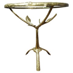 Bronze and glass small table depiciting branches and foliage, 1970's