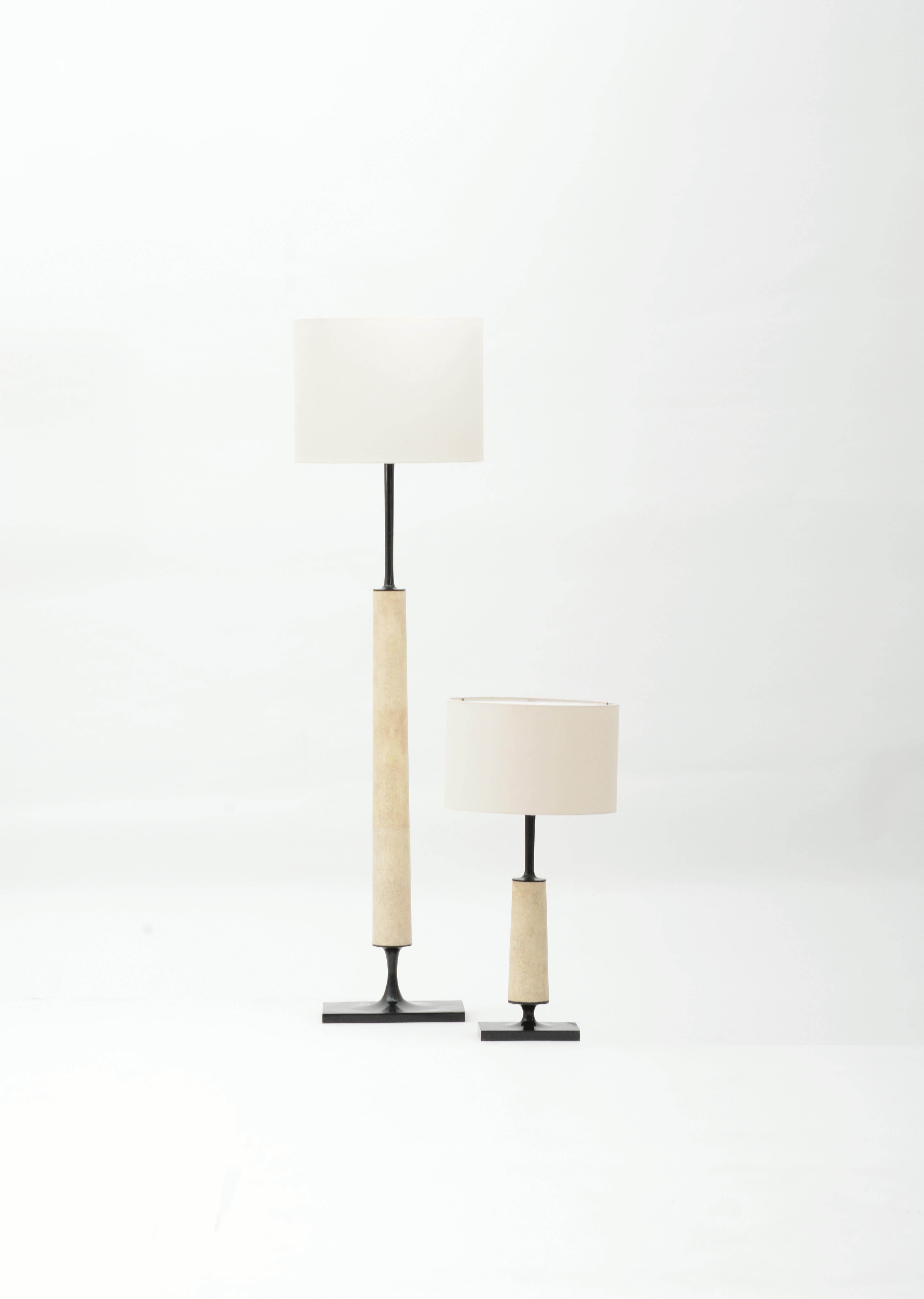 Jaya floor lamp is comprised of a cast bronze base, wrapped in natural shagreen. A classically modern lamp clad in noble materials. The Jaya Lamp is available in custom sizes and finishes by request. 

Dimensions/

Floor Lamp/
w 15.7 x d 15.7 x h