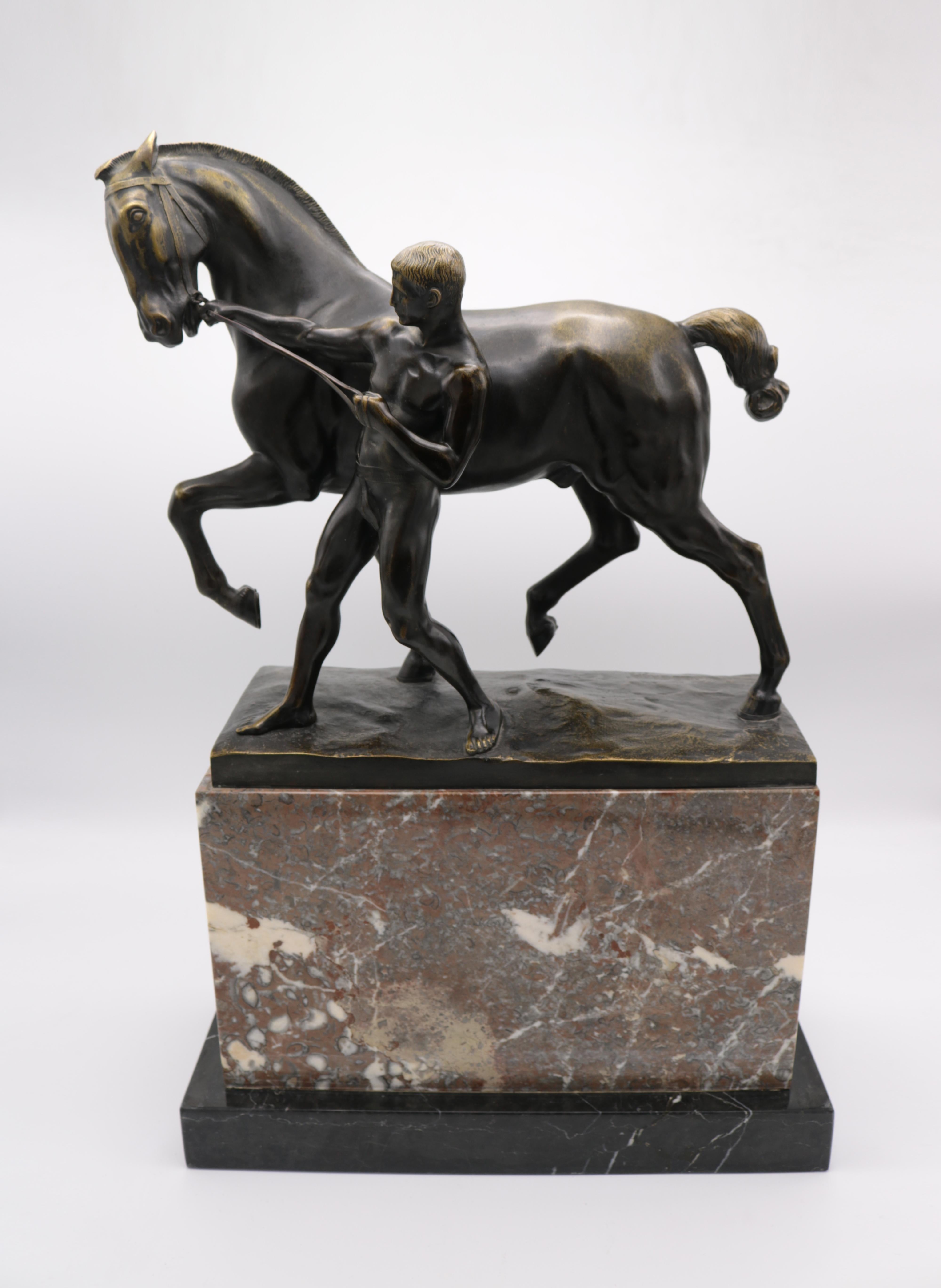 Fine solid bronze sculpture by Rudolff Kaesbach of a man pulling the reigns of a horse. 
Solid bronze mounted on a marble base. 
Signed: R. Kaesbach, Berlin.