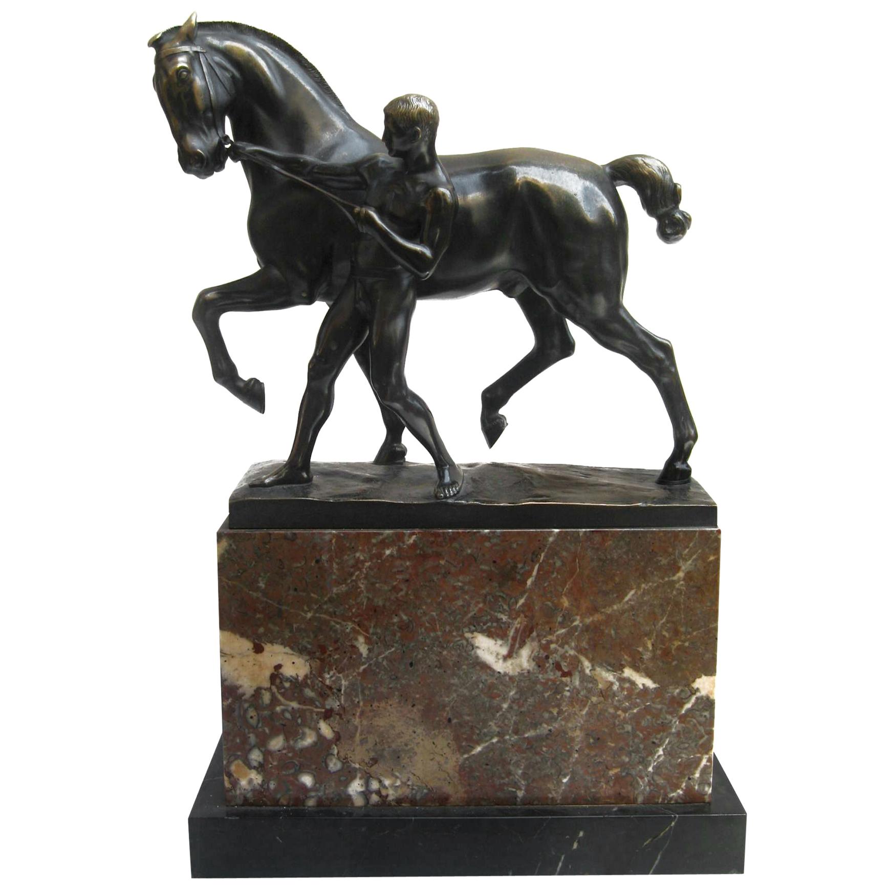 Bronze and Marble Sculpture of a Man Pulling the Reigns of a Horse