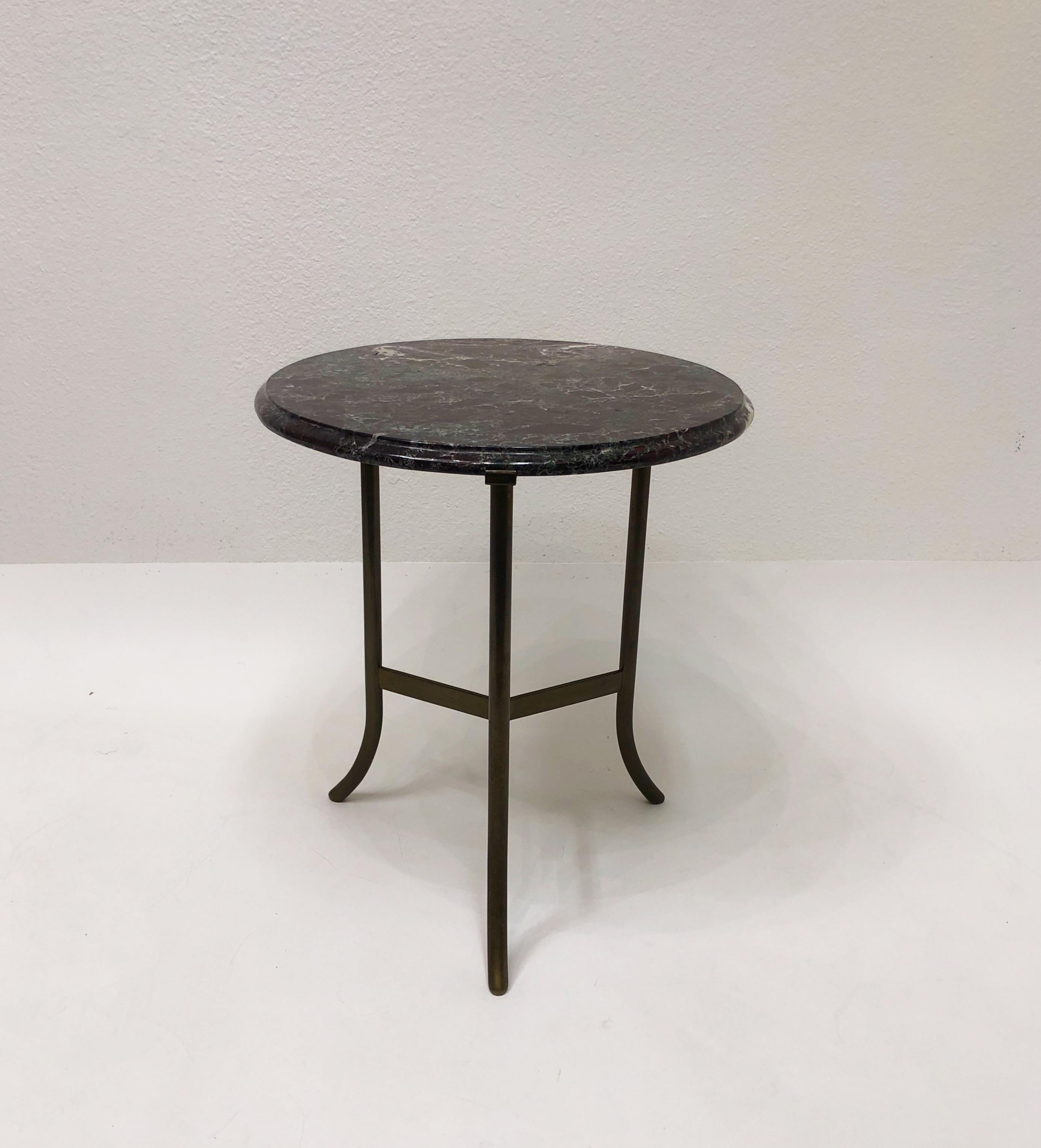 Beautiful 1970’s aged bronze and dark burgundy with green tones marble top side table in the manner of Cedric Hartman. 
In original condition. The top looks like it was professionally repaired(see detail photos).
Measurements: 18” Diameter, 20.38”