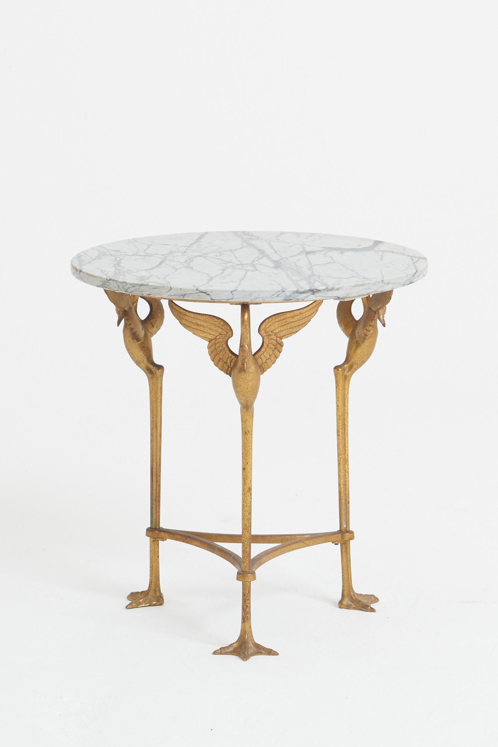An Empire style gilt bronze and marble top side table.
France, Circa 1880-1900
45.5 cm high by 43 cm diameter