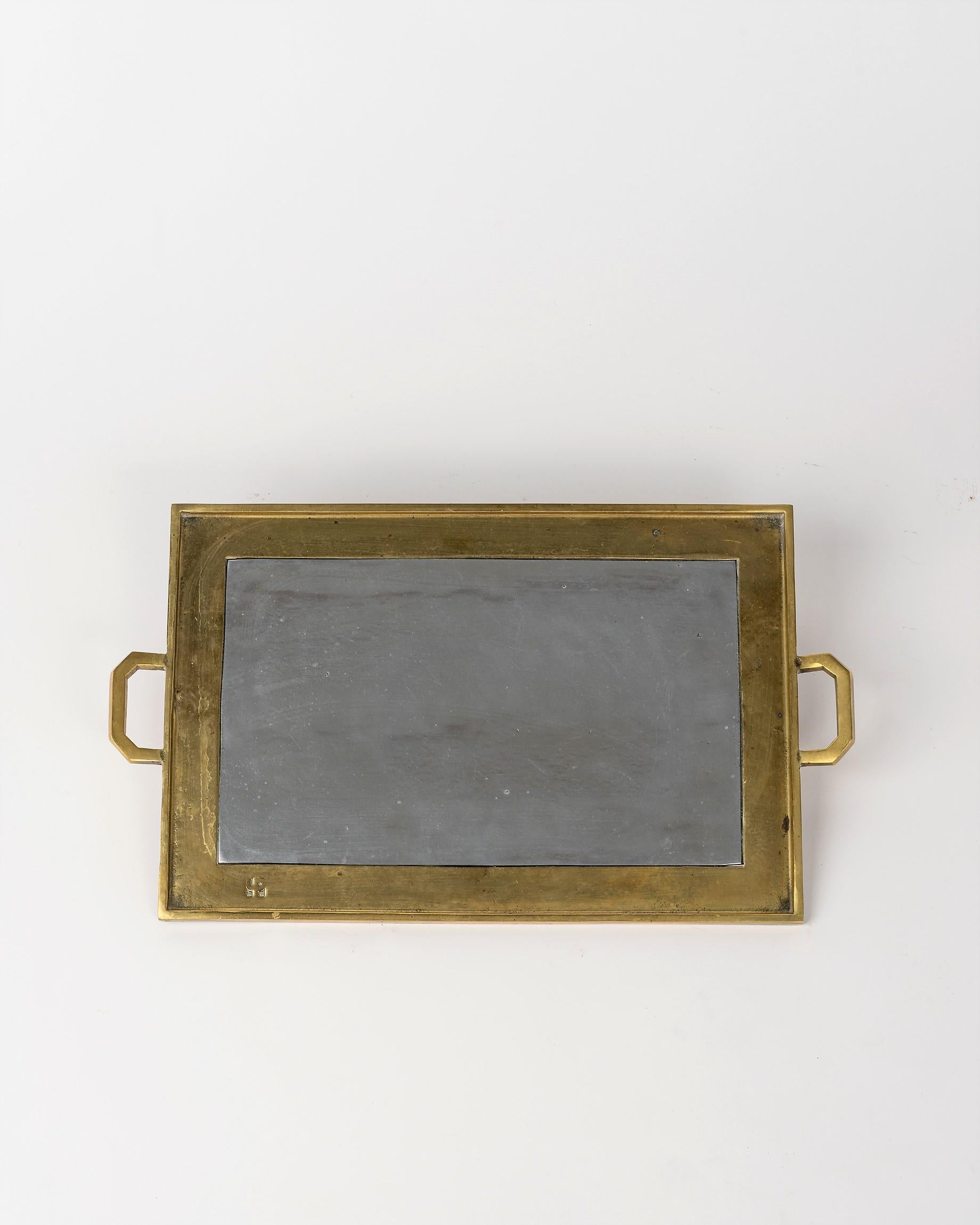 Rare Minimalist tray made of bronze and cast aluminum
Bronze handles
minor angle starting at two thirds of the width 
Signed on the upper right corner ;
Sits on original suede felt
this piece will ship from France and can be returned to either