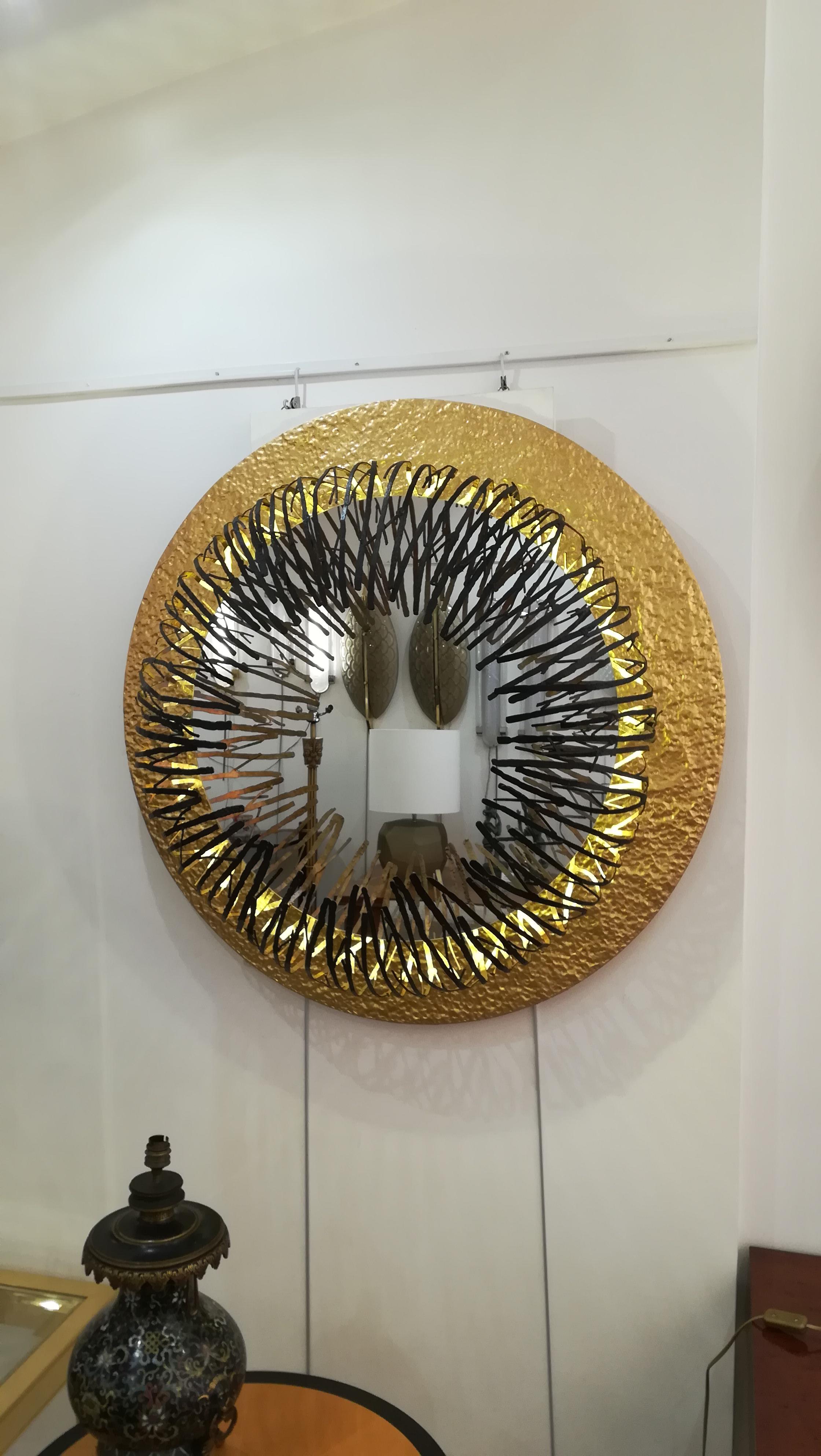 Bronze and patinated metal mirror illuminated by leds all around
Mirror only: 68 cm.