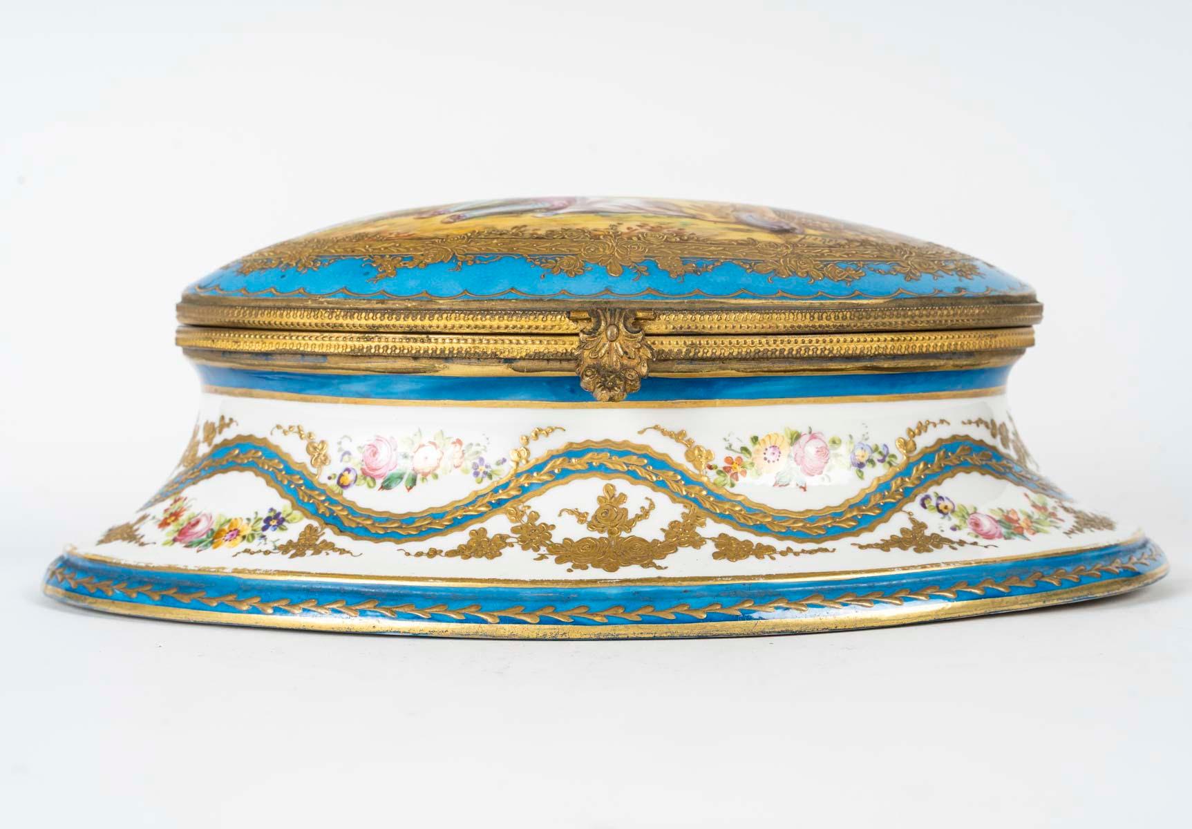 Bronze and porcelain box, Napoleon III period, 19th century.

A 19th century Napoleon III period gilt bronze and Sèvres porcelain box, decorated with garlands and flowers.
H: 16cm, W: 26cm, D: 13cm