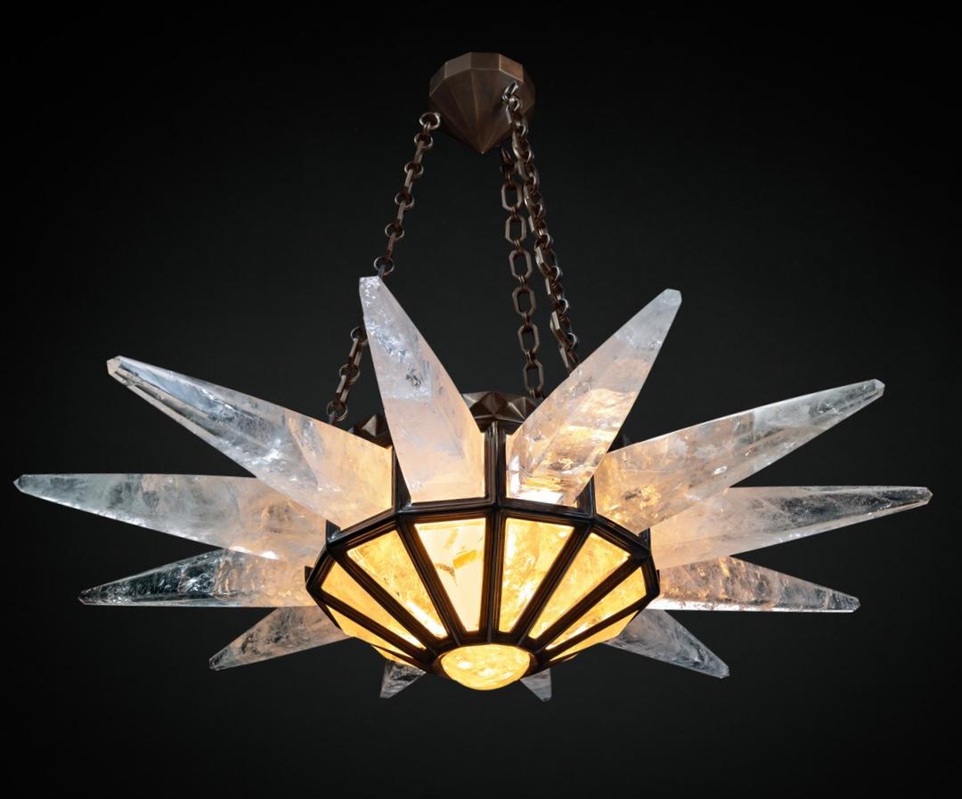Rock crystal quartz sunshine light, antique brass edition.
Original model design by Alexandre Vossion and made since 2014.
The fixture, chains and canopy of this rock crystal chandelier are handmade in bronze in Paris.
Workers who made this model