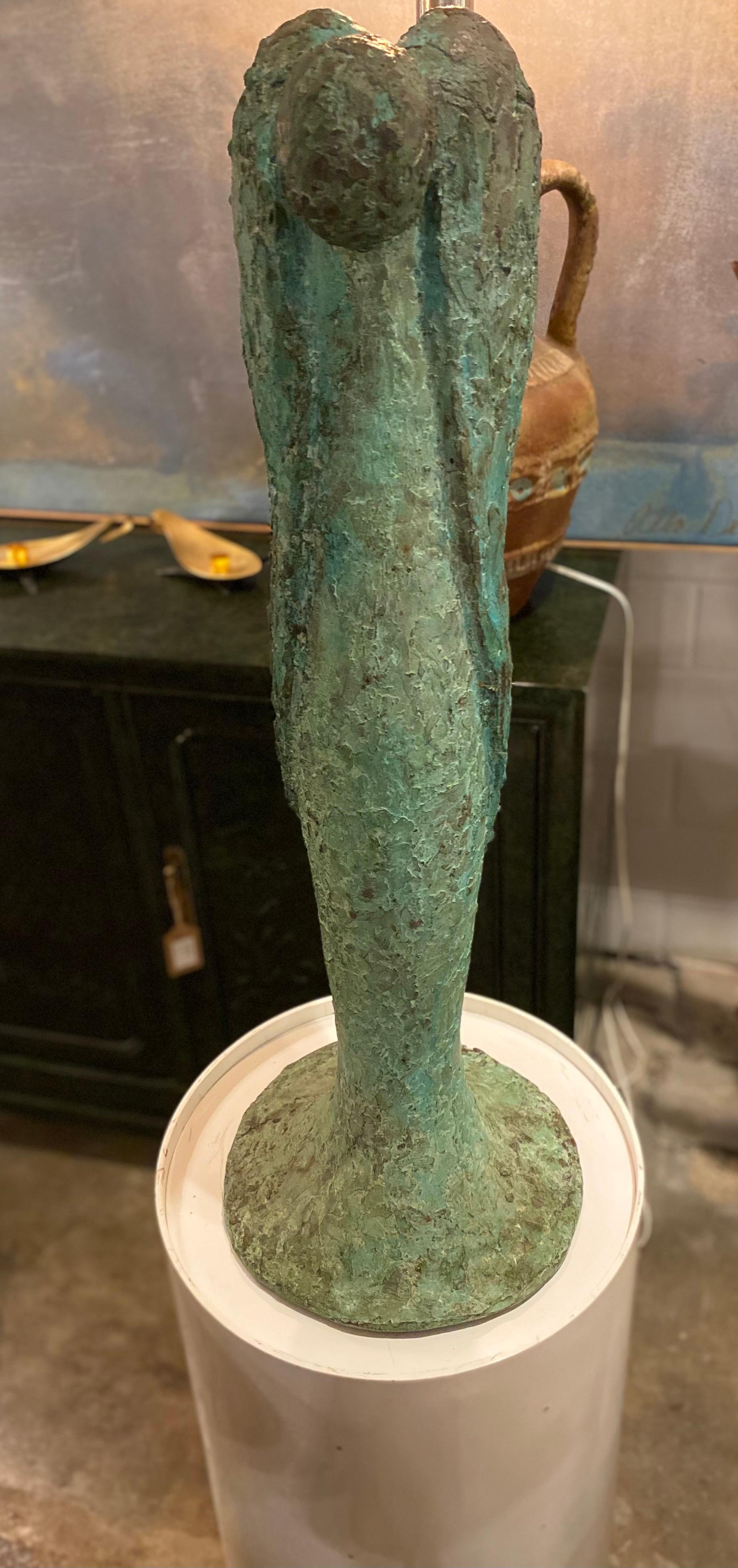 Stunning bronze sculpture of an angel looking downwards by Texas artist, Betty Gerald. The sculpture is patinated and in overall good condition.