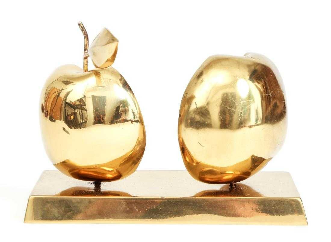 David Meshulam (Israeli Bulgarian 1930-1987) original bronze halved apple sculpture, including base stand with inscribed signature and date (1977) numbered 7/8. Base is shaped like a bar of gold bullion. The apple halves are removable via screws