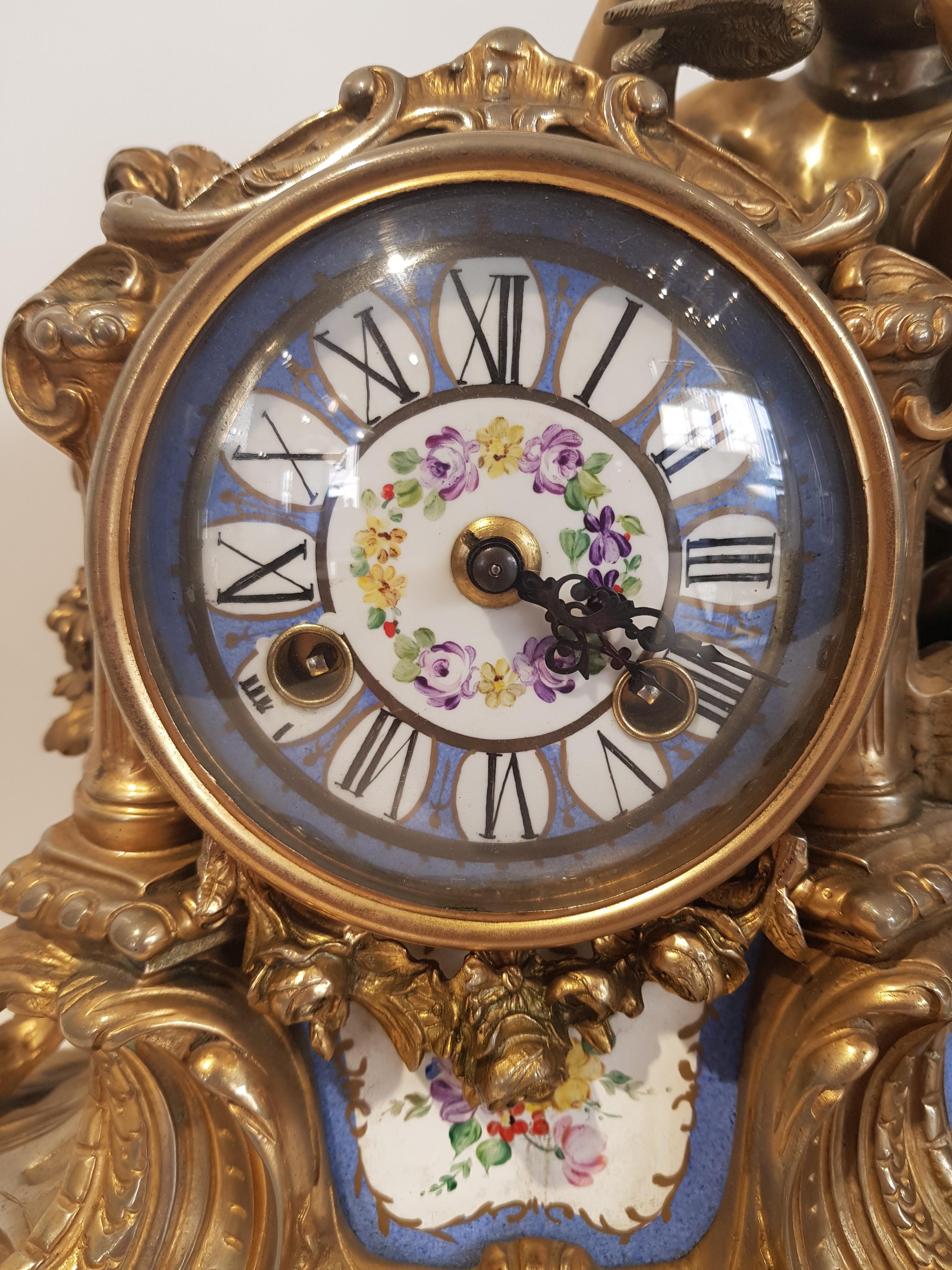 Bronze and gold bath clock with hand-painted porcelain inserts with 