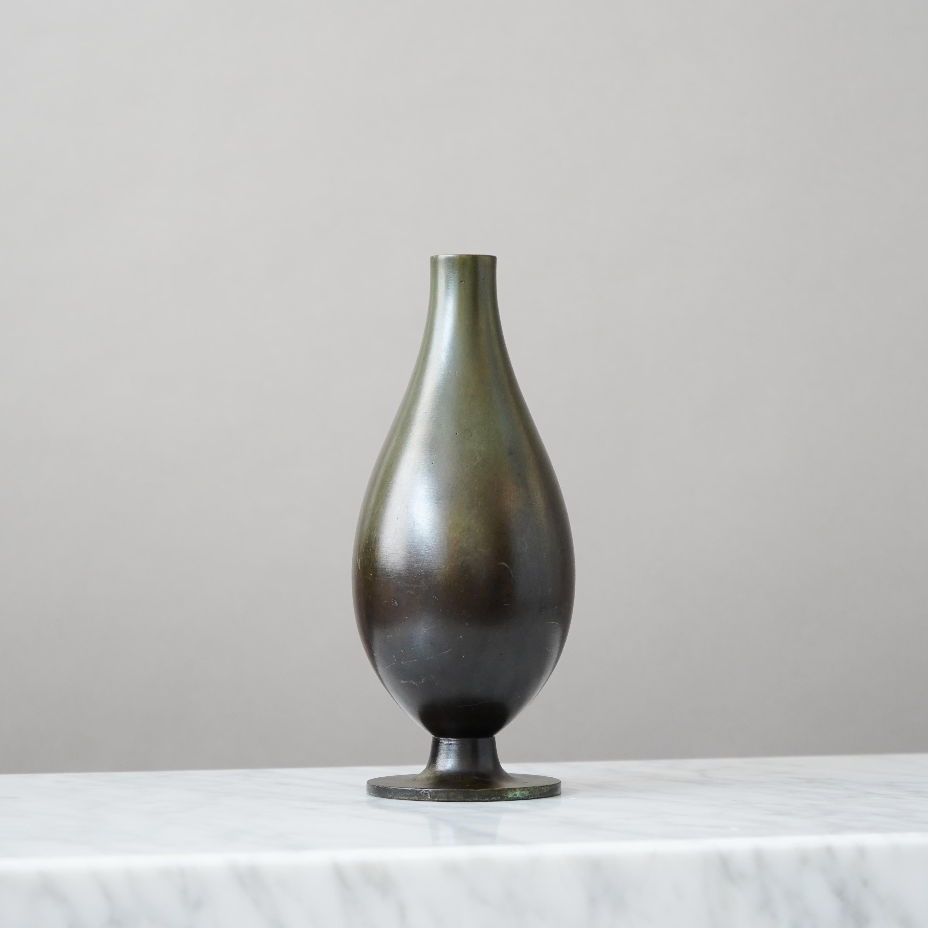 A beautiful bronze vase with amazing patina. 
Produced by GAB Guldsmedsaktiebolaget, Sweden, 1930s.

Good condition, but with an inscription (pictured) and some scratches.
Stamped 'BRONS' and makers mark.

GAB was founded in Stockholm in 1867 and