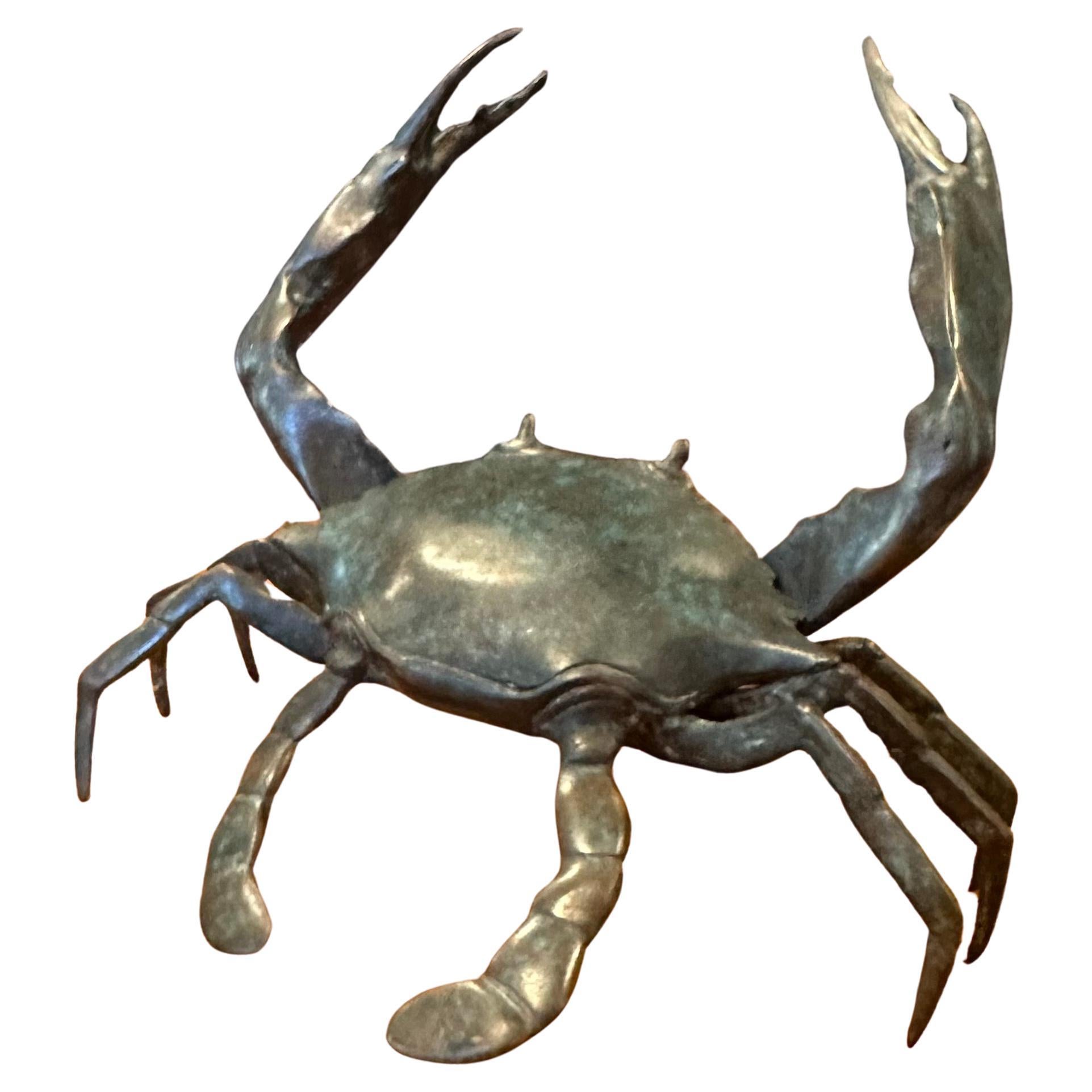 A well detailed and patinated articulated bronze crab sculpture, circa 1970s. The piece is in very good vintage condition and measures .5