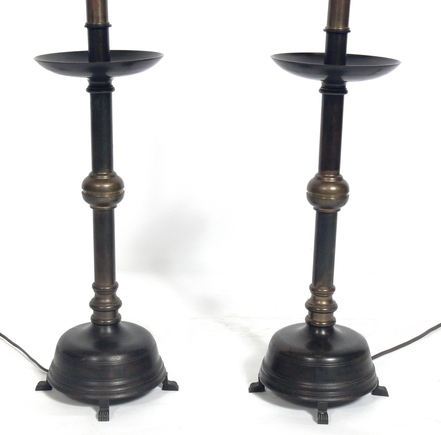 Bronze Asian style lamps, circa 1950s. They retain their wonderful original patina to the bronze. They have been rewired and are ready to use. The price noted below includes the shades.