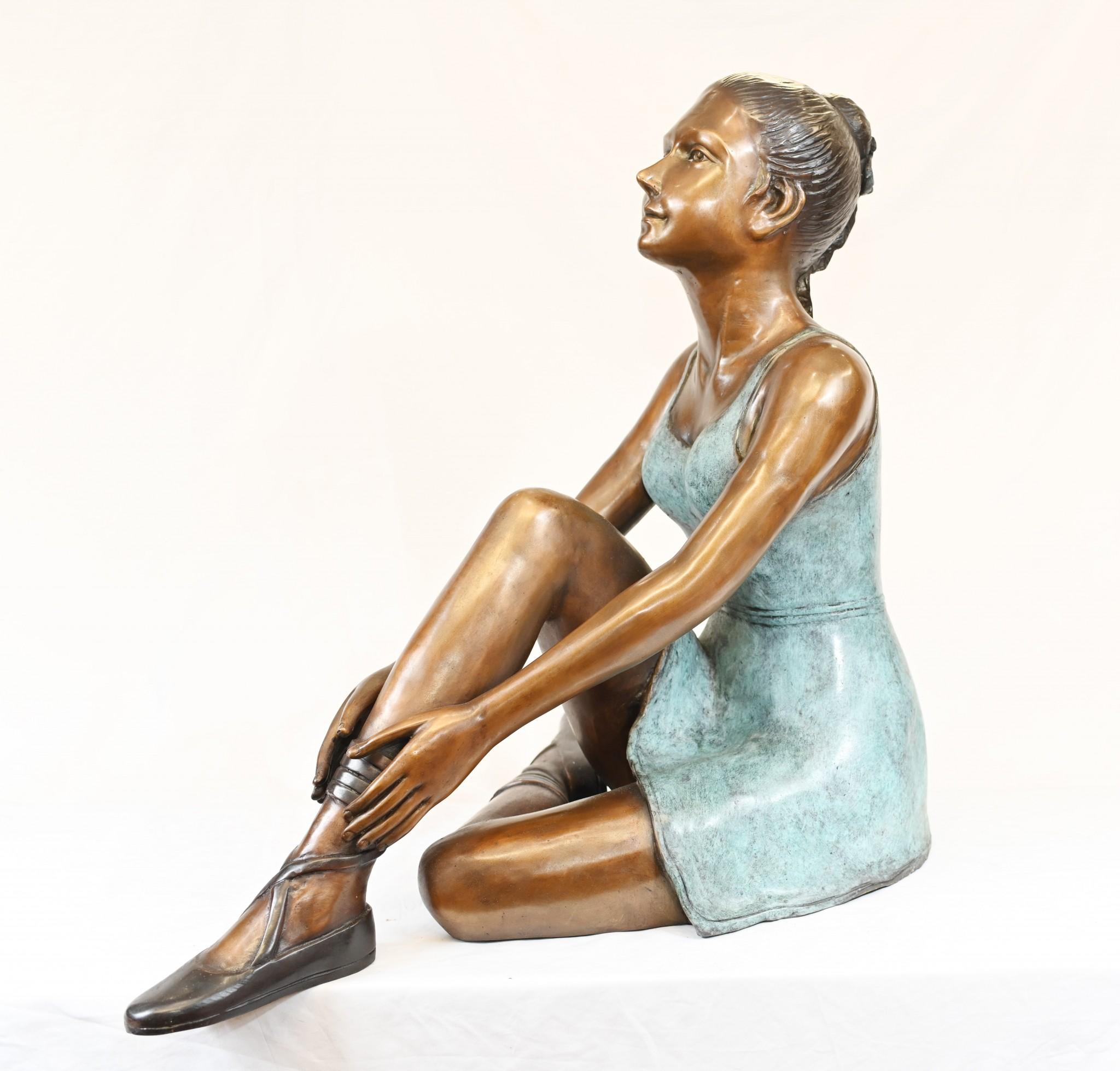 Gorgeous bronze statue of a seated ballerina
Charming work of art, lovely patina to the bronze
Green dress offset by brown of arms and body
Very well cast and great for a garden
Of course being bronze this can live outside with no fear of