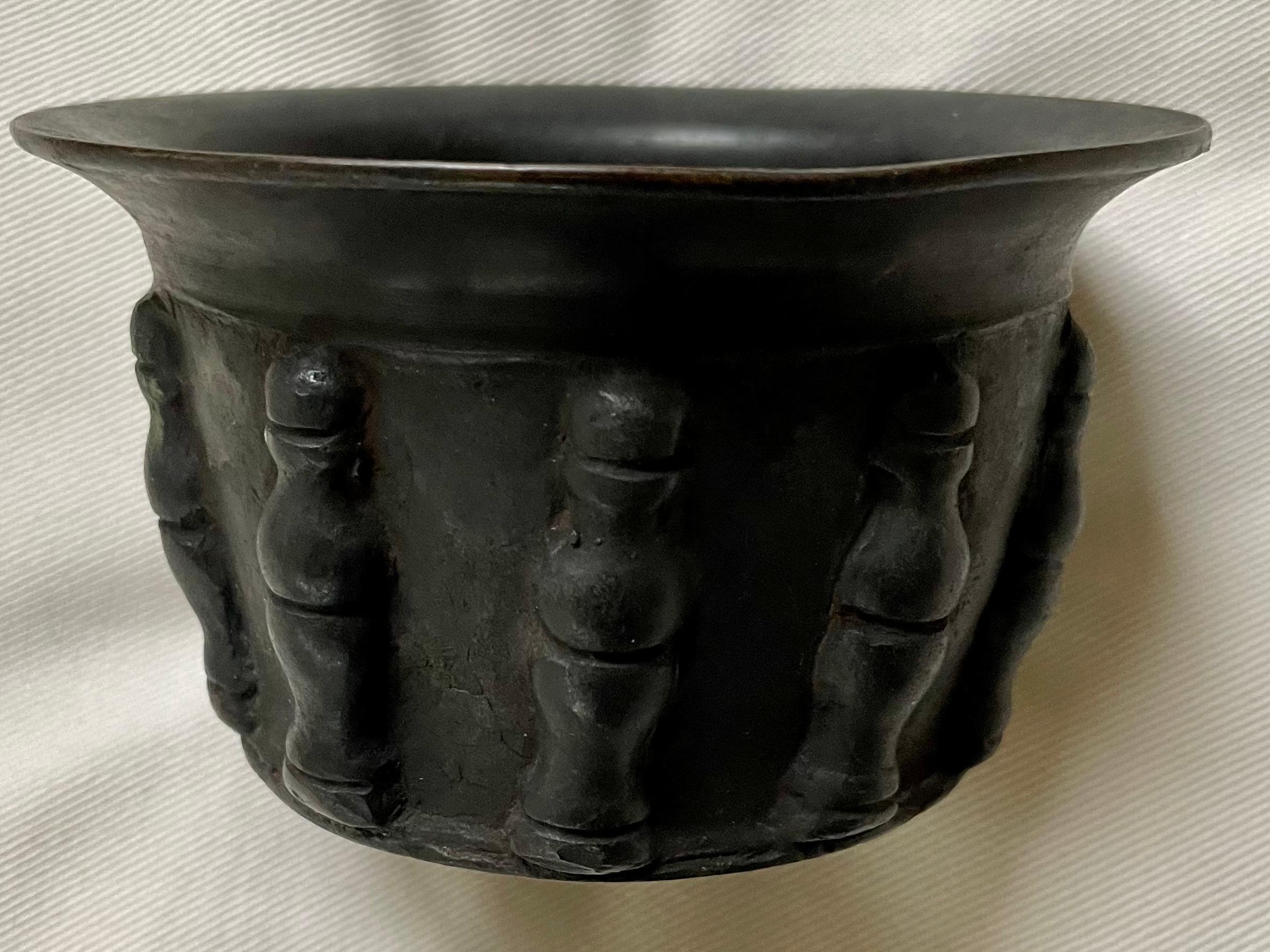 Bronze baluster bowl. Antique bronze votive bowl with ten bronze balusters punctuating the outer surface in high relief. Italy 16th century. 

Dimensions: 5” diameter top x 3.25