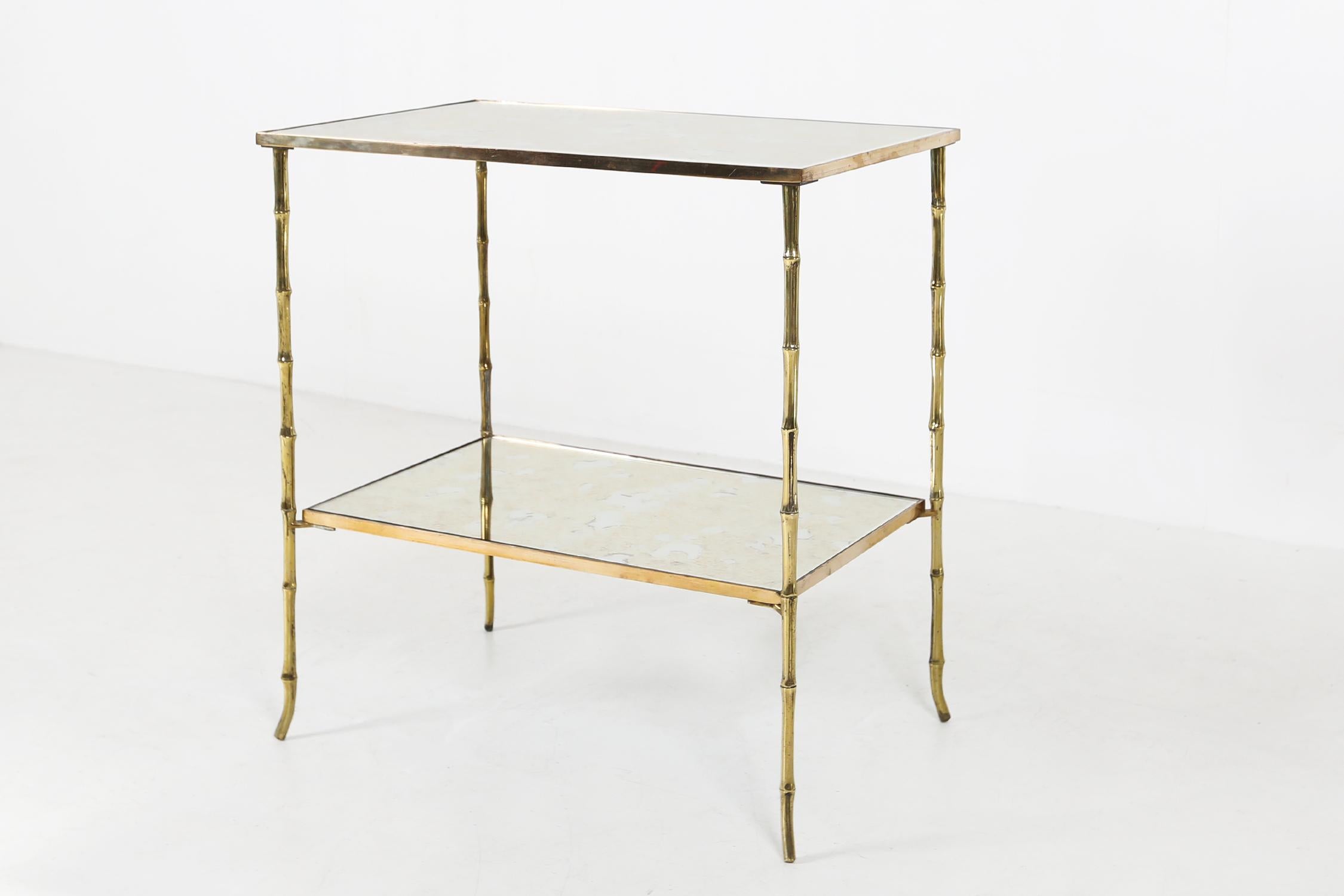 Bronze coffee table by Maison Bagues Ca.1960.
With bronze frame and smoked glass.