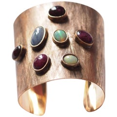 Bangle in bronzo con zaffiro blu opale rubino