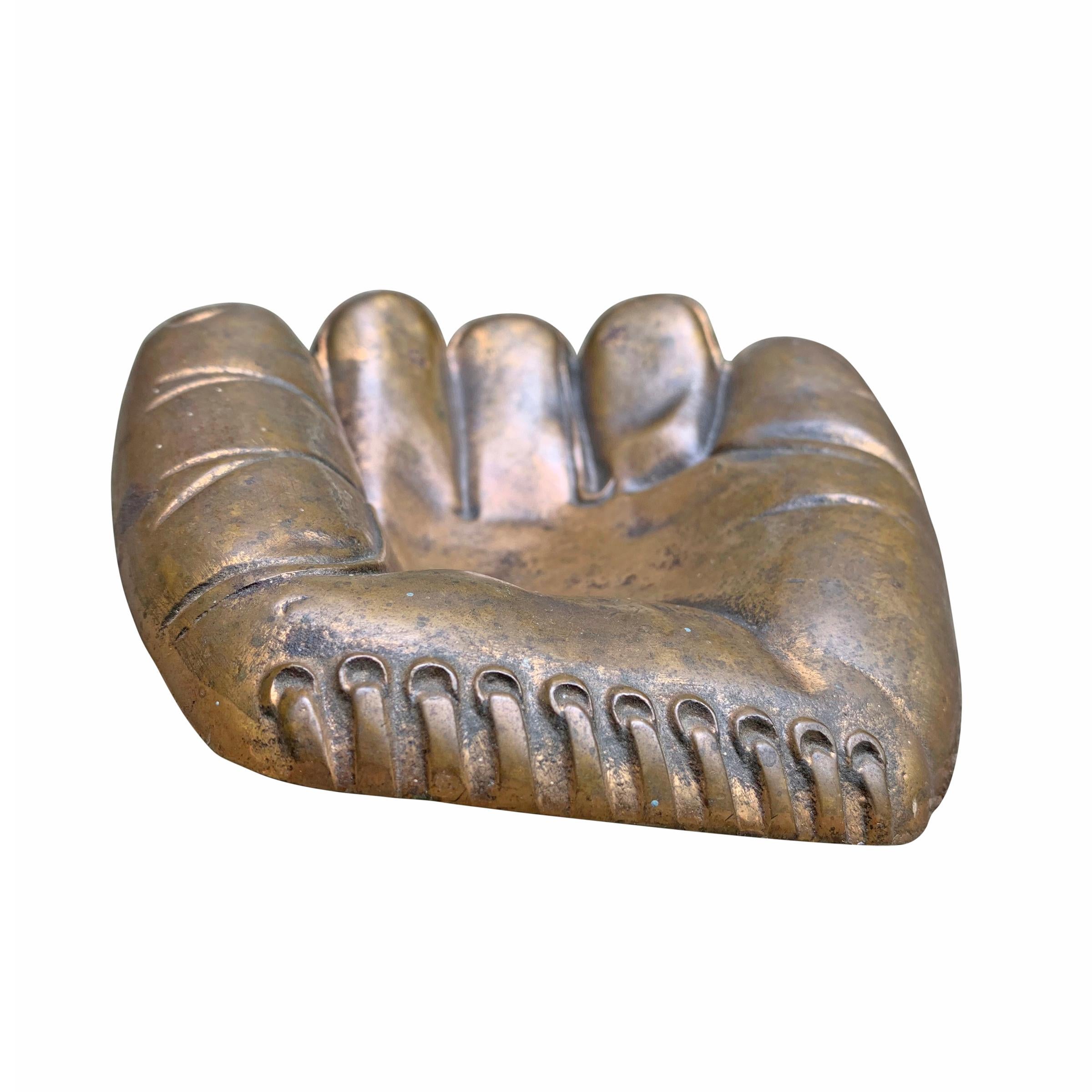 A whimsical mid-20th century American cast bronze baseball glove bowl to catch all of your change, keys, or your particular vice.