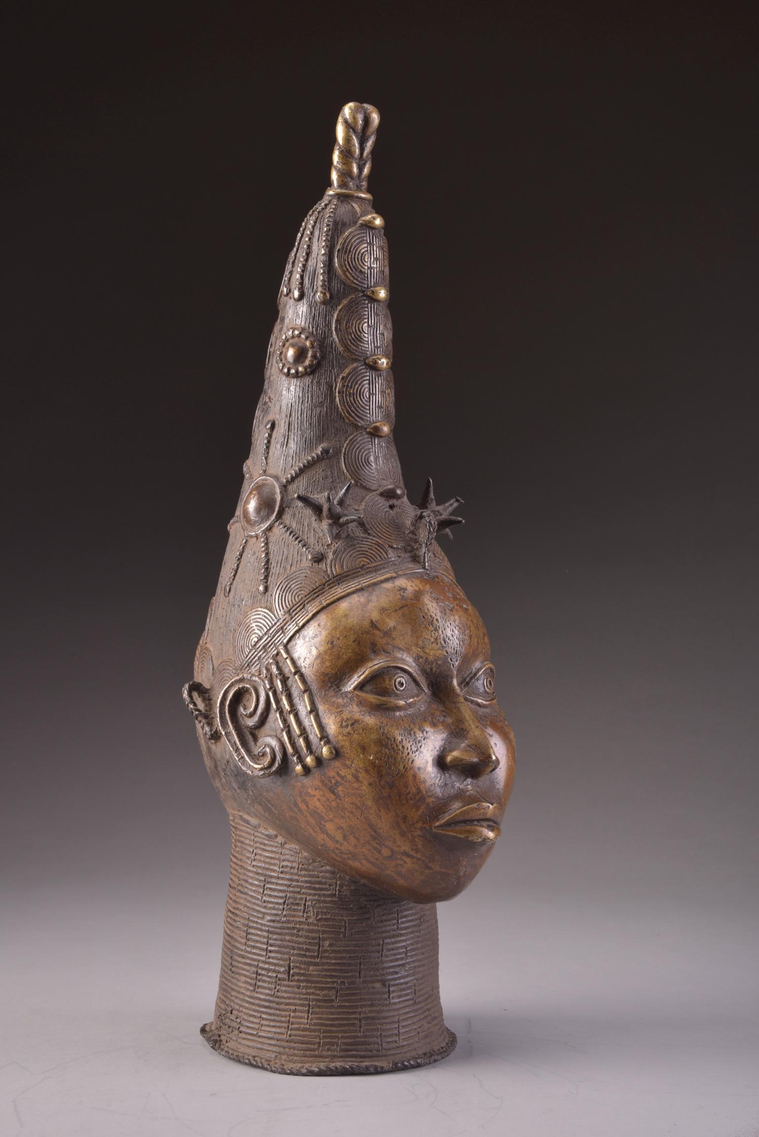 Head of a Queen Mother. Nigeria, Edo, Benin 20th century. Measures: H 23 in. (58 cm)
11.8 lbs (5.35 KG).