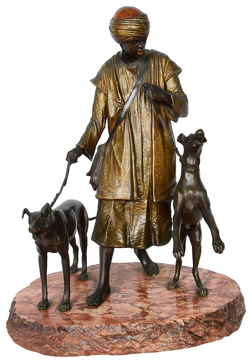 This wonderful quality late 19th Century cold painted bronze statue of an Arab, Houndsman, mounted on a Rouge marble base, in the manner of Franz Bergman.
Franz Xaver Bergman (or Bergmann) was a celebrated owner of a Viennese bronze foundry