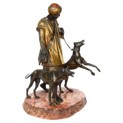 Antique Bronze, Bergman style 19th Century Arab hounds man.