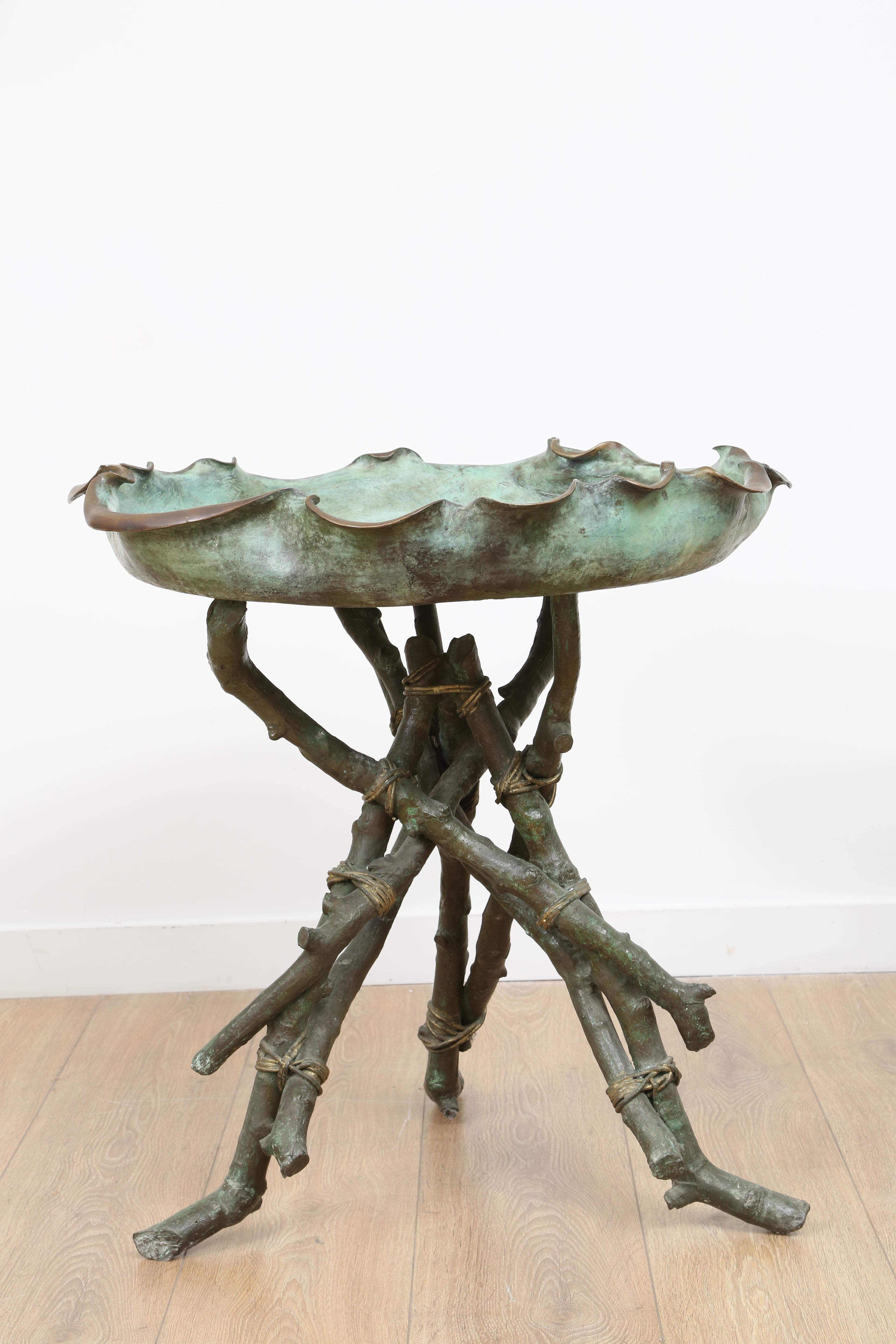 Italian grand tour bronze bird bath or center table

Rare Italian late 19th century, naturalistic bird bath or can also be used as a center table with a glass top. Bronze tripod base with twigs supporting an organic shaped basin. Craftsmanship is