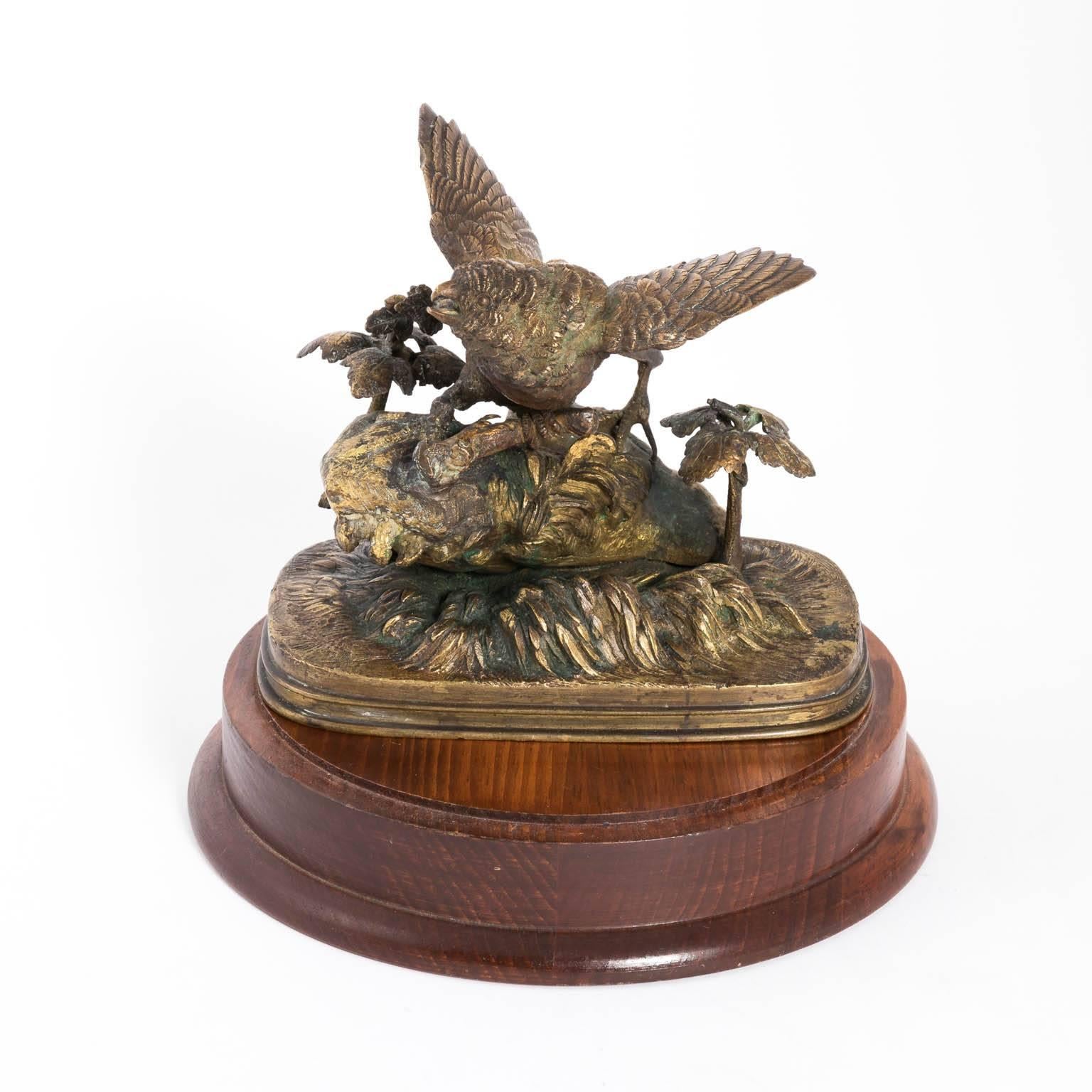 French bronze bird sculpture in a glass dome on a wooden base by Ferdinand Pautrot, circa 1895.
 