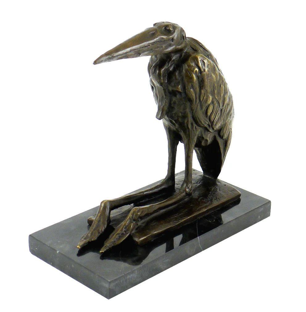This bronze sculpture in the taste of Rembrandt Bugatti is a expressive example of 20th-century animal art. This sculpture portrays a seated stork with elongated legs and a poised, contemplative posture. 

This animal bronze sculpture is more than