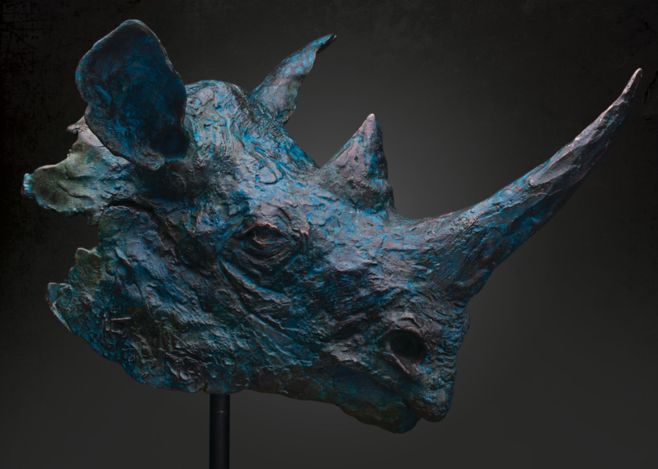 Black Rhino Bust in Verdigris Blue, Bronze Sculpture on Sandstone Base – Limited Edition of 12

The Black Rhino is one of Africa’s most formidable creatures, yet also among its most vulnerable. This bronze bust, finished in a deep blue verdigris