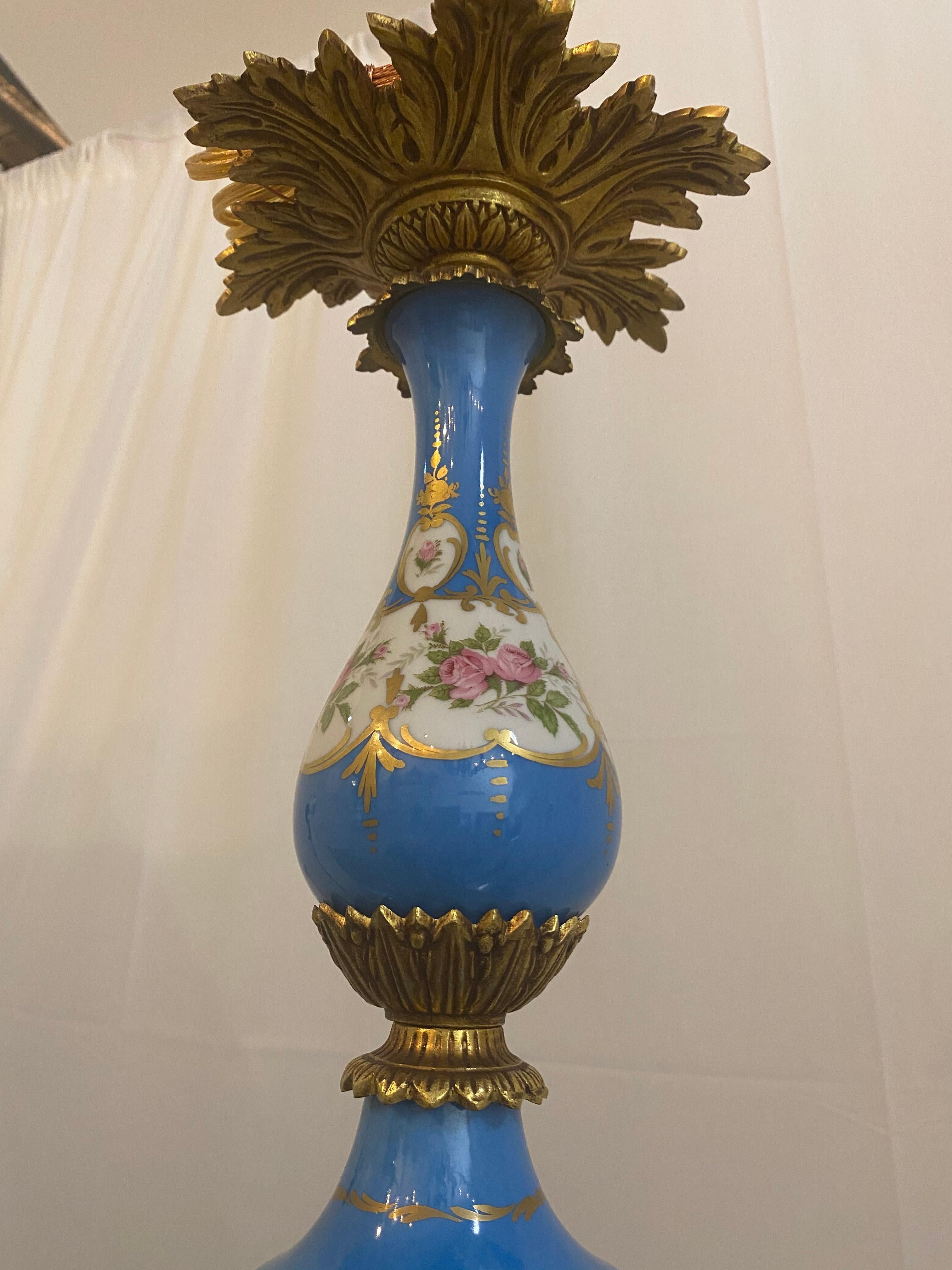 Vintage bronze, blue opaline floral chandelier, amazing color and pictures with floral design around the candle holders, and on the center. Bronze all on the edges making it look beautiful.