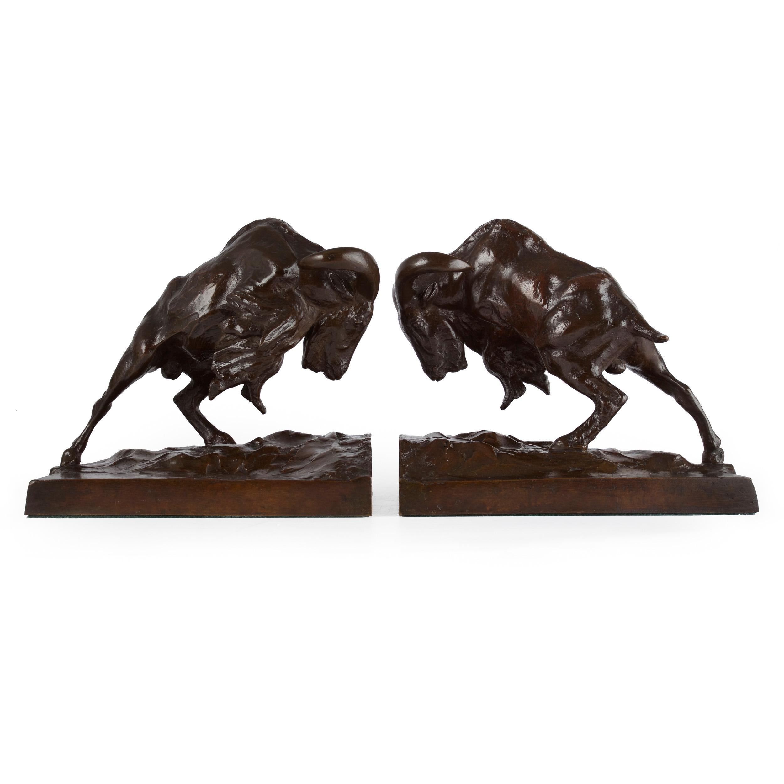 An exquisite casting of Anna Vaughn Hyatt Huntington's bookend sculptures of Charging Mountain Goats executed by the Gorham foundry, the models capture an intensity and drama that is palpable. With their front legs withdrawn and balanced for an