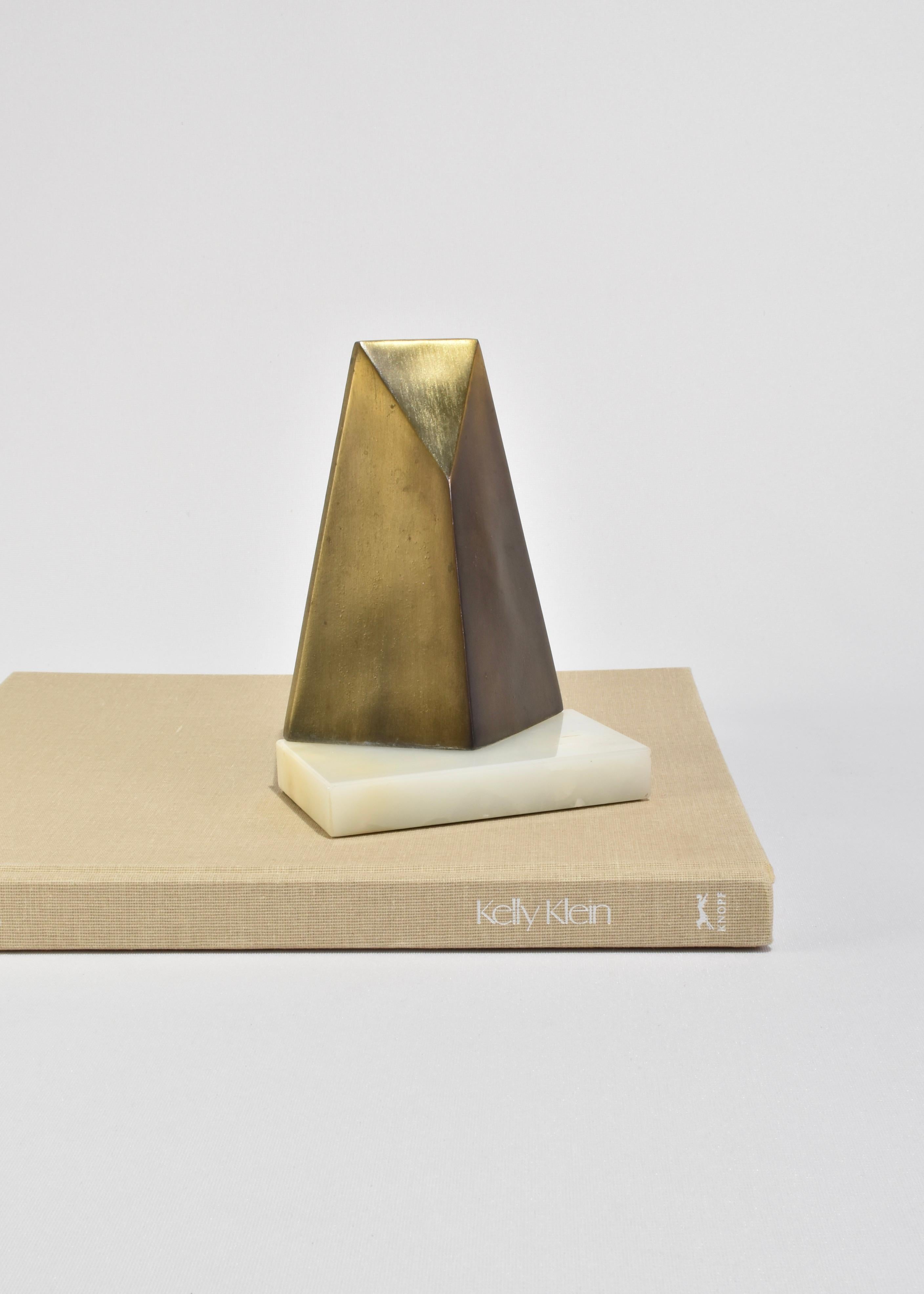 Rare, deco style bookends with an onyx base and sculptural bronze detail. Stamped on back, W. Macowski 1971.