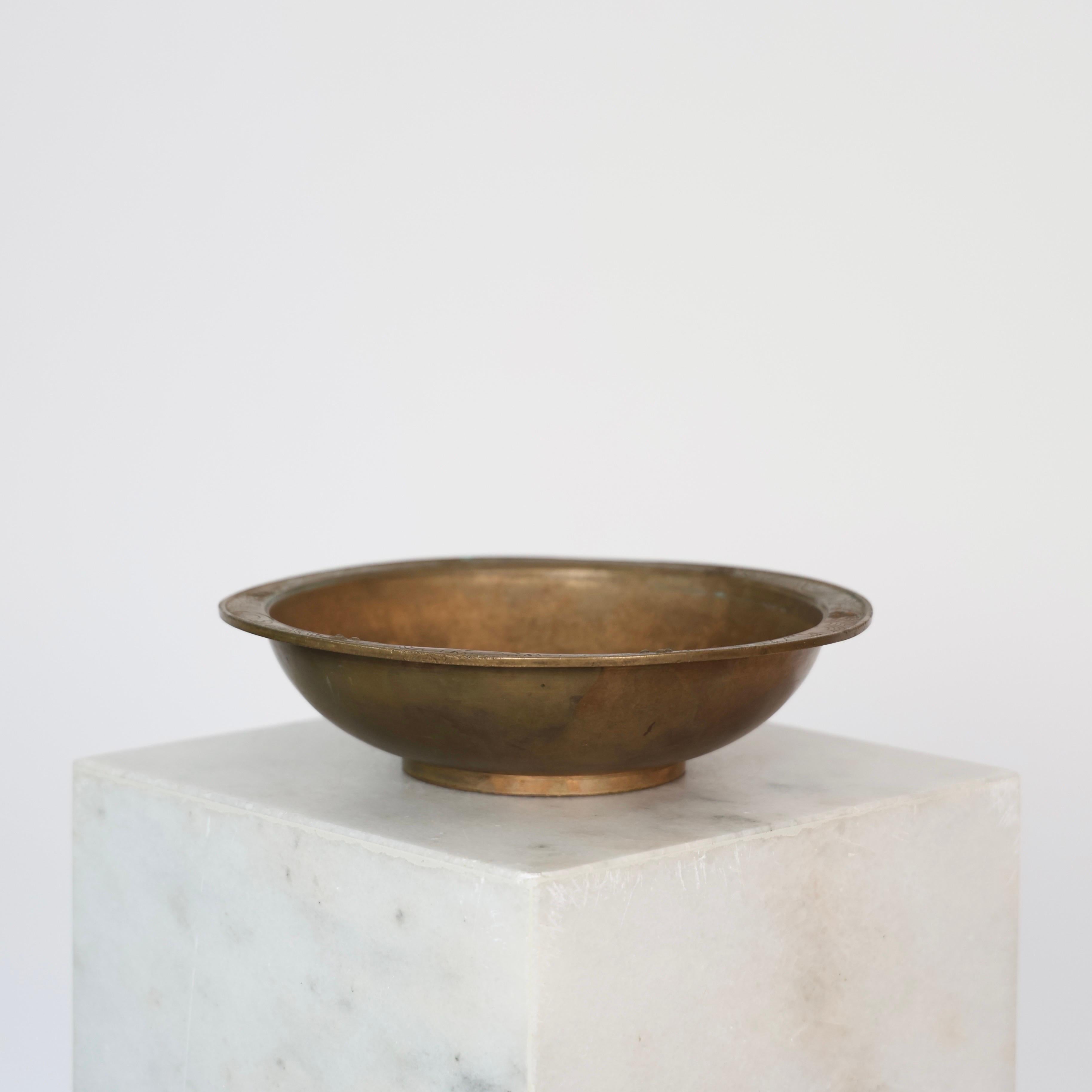 Heavy Bronze Bowl made by Just Andersen in the 1920s. 

* Round heavy bowl in full bronze with border bands.
* Designer: Just Andersen
* Model: B8
* Year: 1925
* Condition: Fair vintage condition. Makers engravings intact. Rustic patina inside and