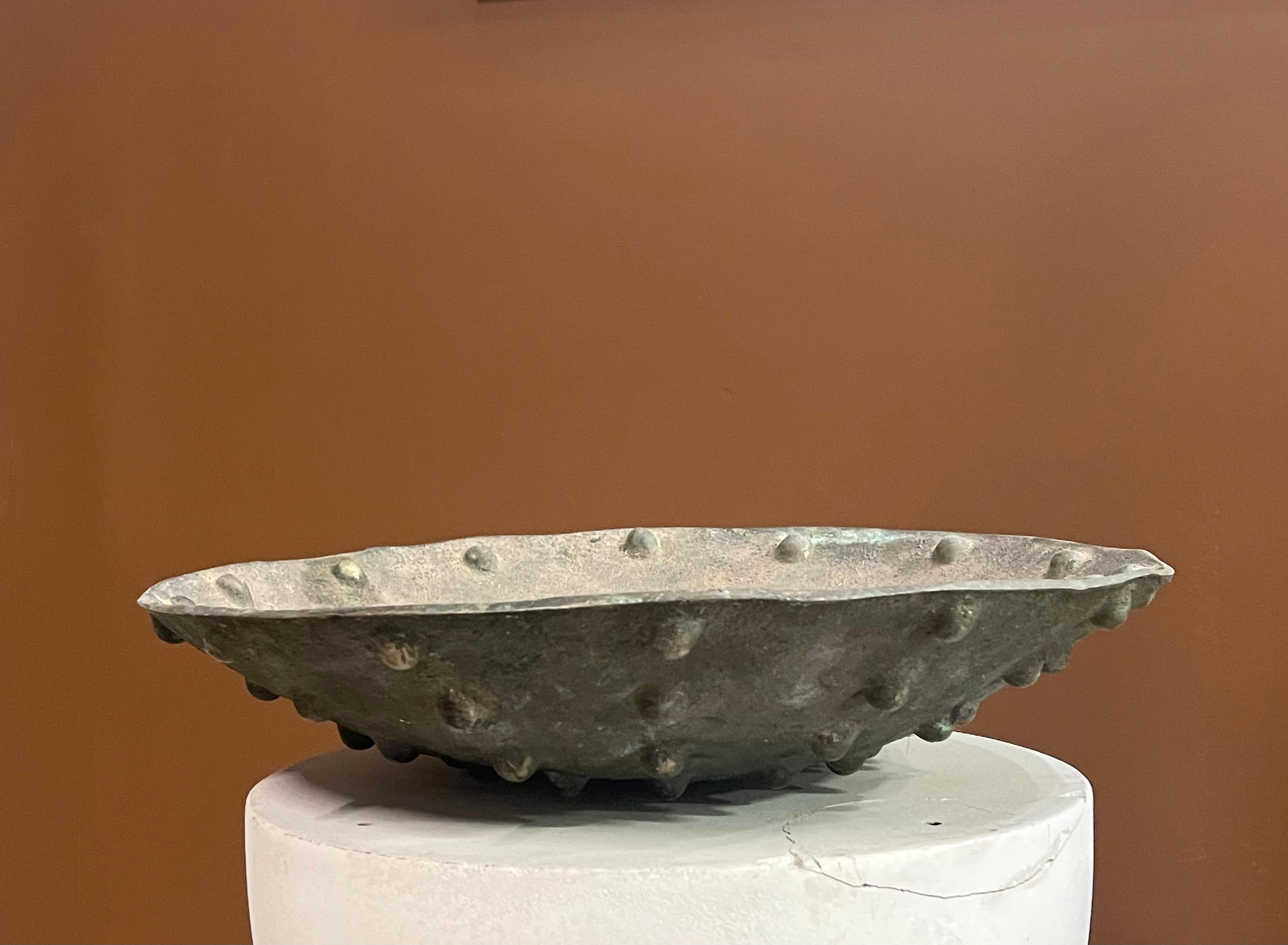 A beautiful bronze sculptural bowl heavily tarnished with an 18 inch diameter and 4 inches tall.