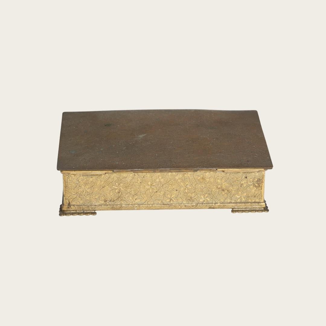 1947, Sweden. Bronze box features a wooden-clad interior engraved with a personalized gift message. The exterior showcases a cast foliage pattern, with 