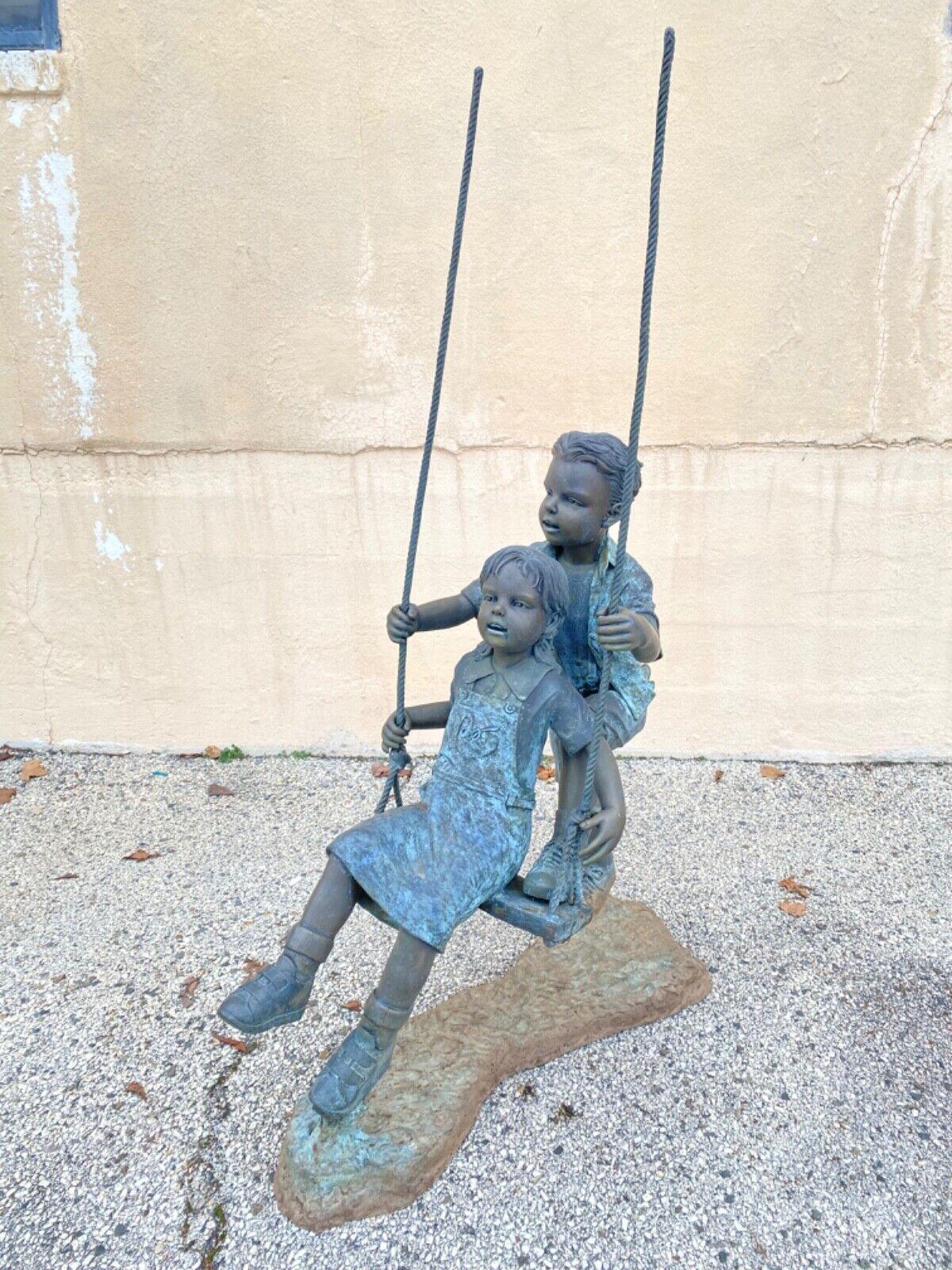 Large Bronze Boy and Girl Children Swinging Garden Outdoor Statue Sculpture. Item features great detail throughout, fun and whimsical form, approx 150 lbs. Circa Late 20th Century. Measurements: 64
