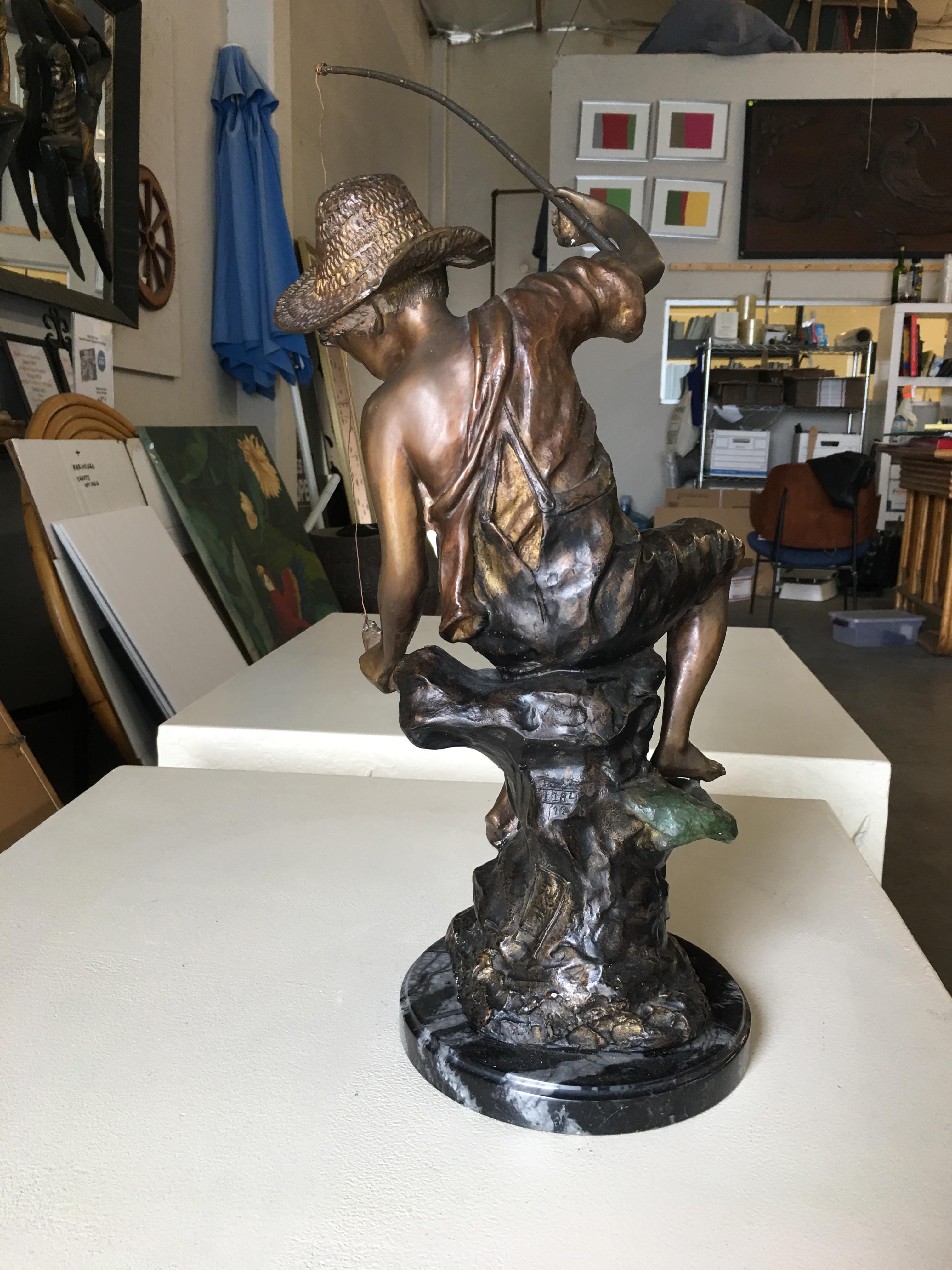 vintage fishing boy statue