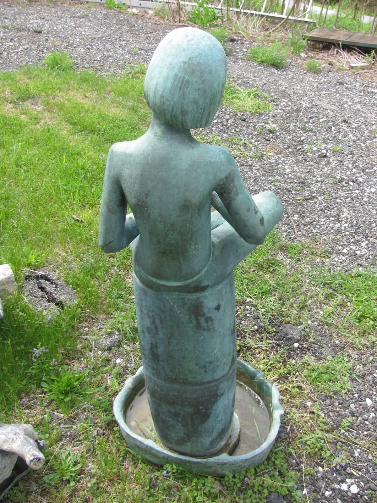 Bronze fountain of a boy flutist by Sylvia Shaw Judson Hawkins. Famous artist from the Chicago area who has created the bronze which is on the cover of the book Midnight in the Garden of Good and Evil. Fountain is signed SSJ. This is the top of a