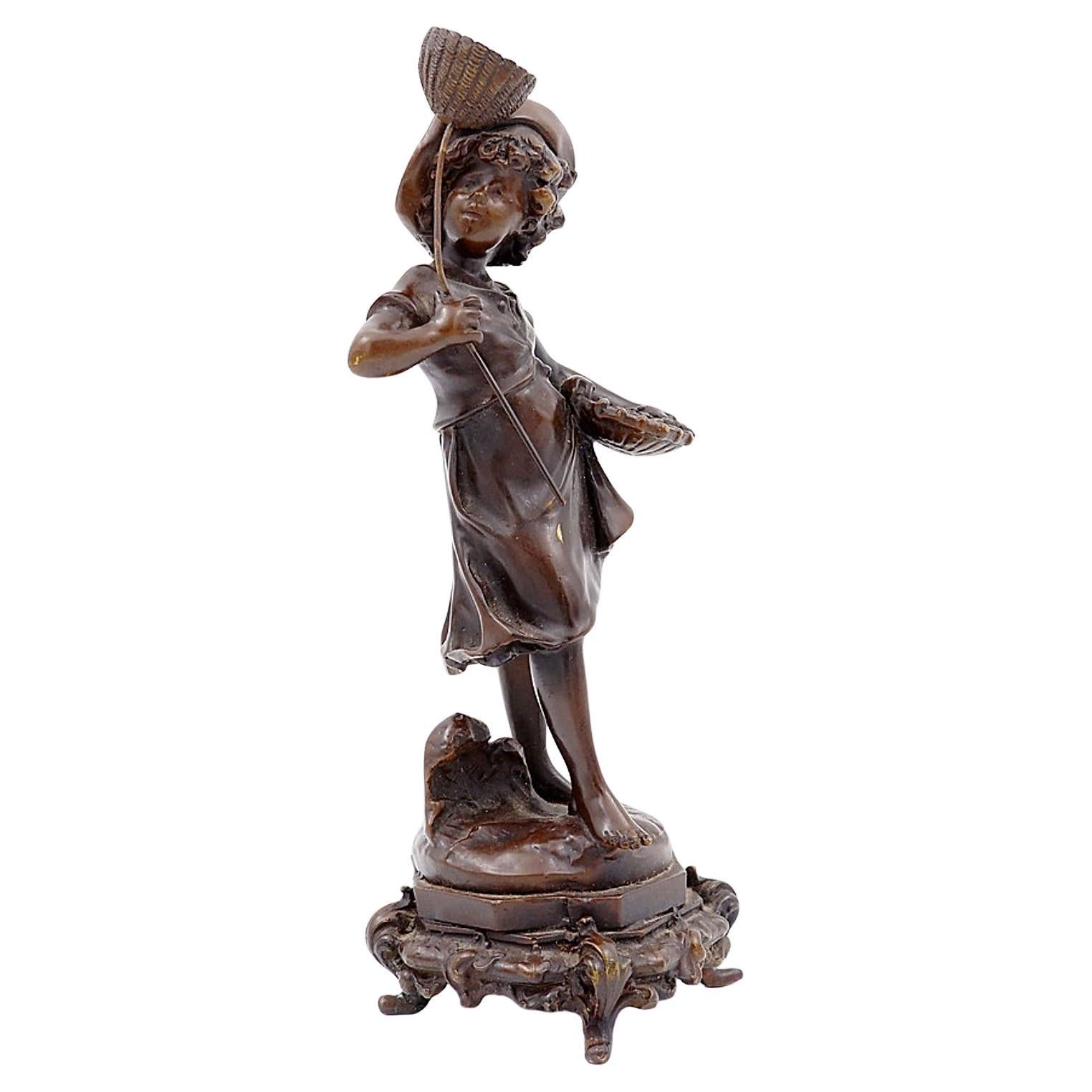Niño de bronce con mariposa De Auguste Moreau, Francia, finales del siglo XIX
