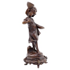 Niño de bronce con mariposa De Auguste Moreau, Francia, finales del siglo XIX