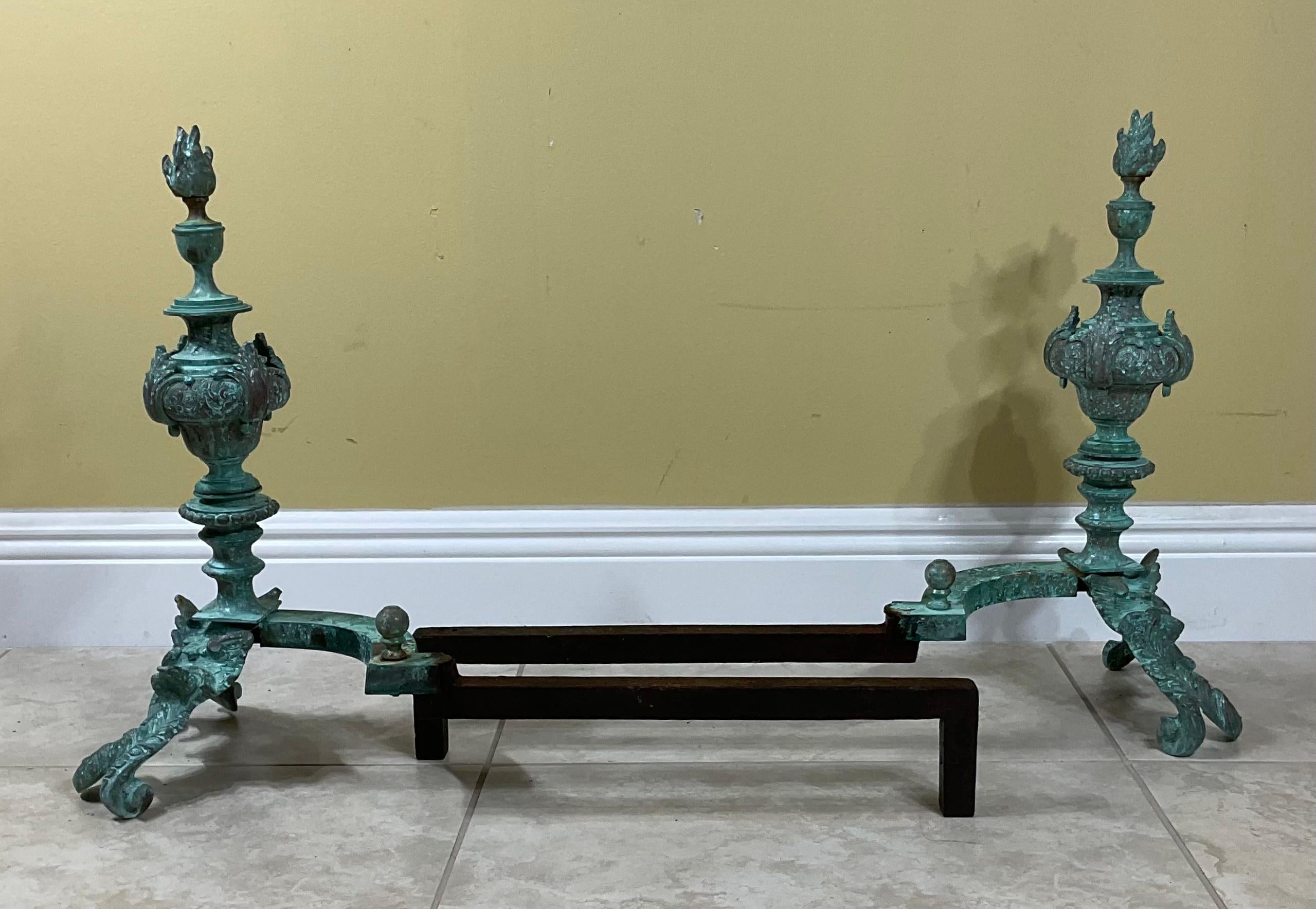 Beautiful pair of andirons featuring two Rococo late-Baroque styled in Classic asymmetrical patterns, great looking patina .
 