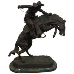 Bronze  Remington Titled 'Bronco Buster'