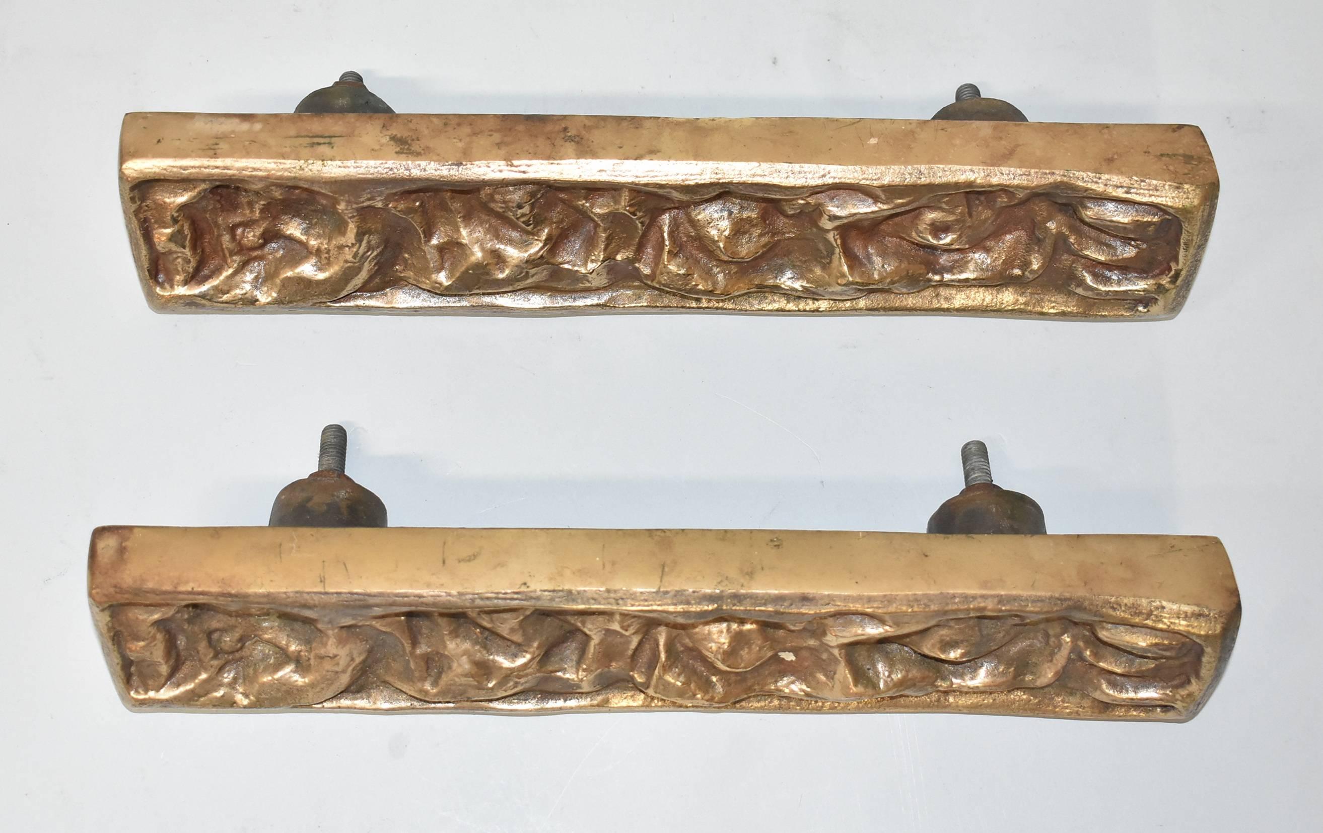Heavy bronze brutalist deep relief pair door pulls attributed to architect Sherrill Broudy and sculpture Joy Verner. Stamped on the back H9.