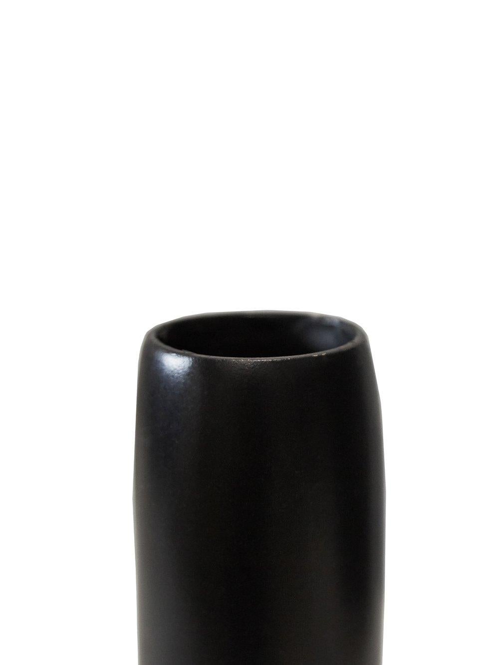Bronze bud vase by Rick Owens
2019
Dimensions: L 9 x W 9 x H 16 cm
Materials: Bronze
Weight: 1.5 kg

Rick Owens is a California-born fashion and furniture has developed a unique style that he describes as “luxe minimalism.”
Though his designs