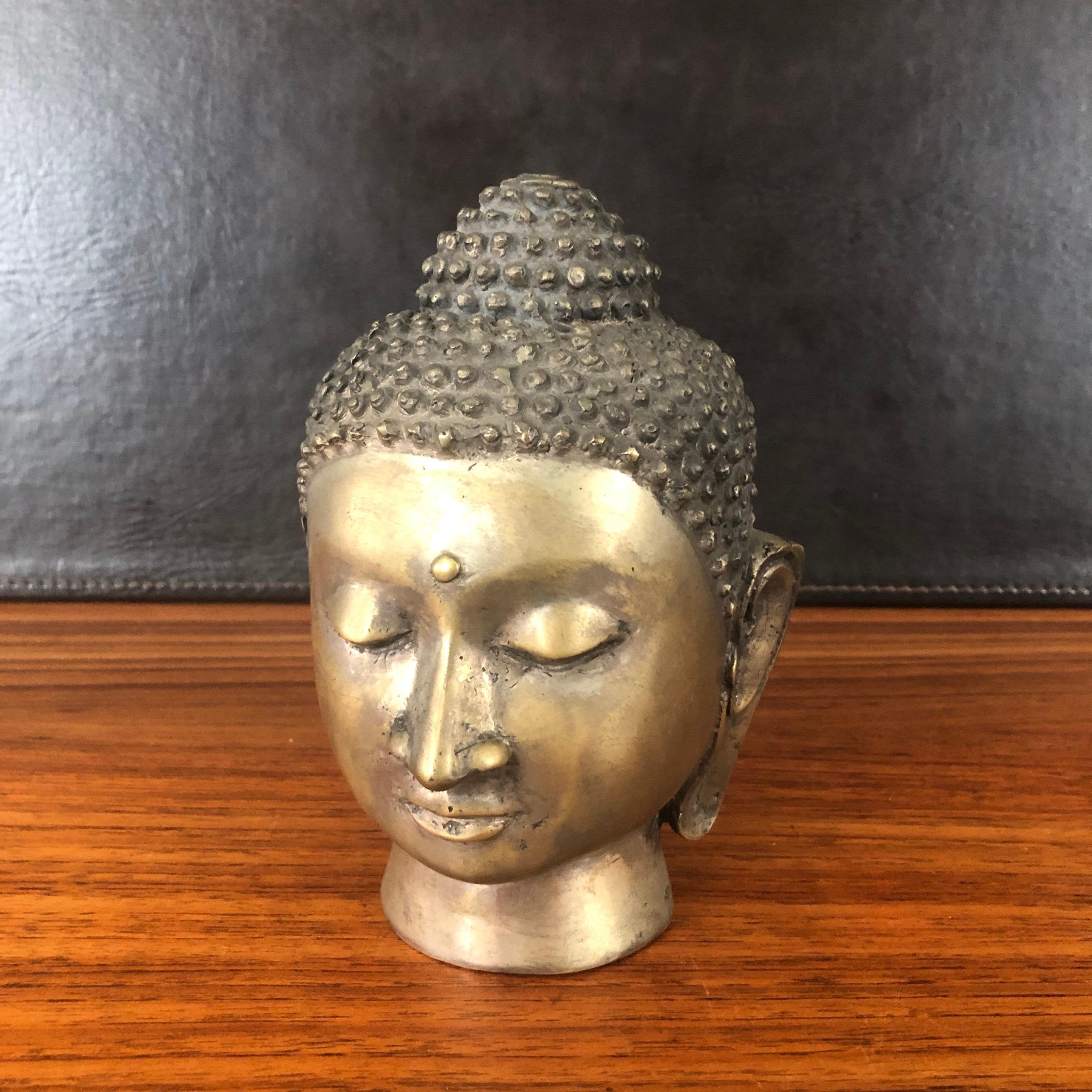 Decorative bronze Buddha head, circa 1970s. The piece is in very good vintage condition and measures: 5