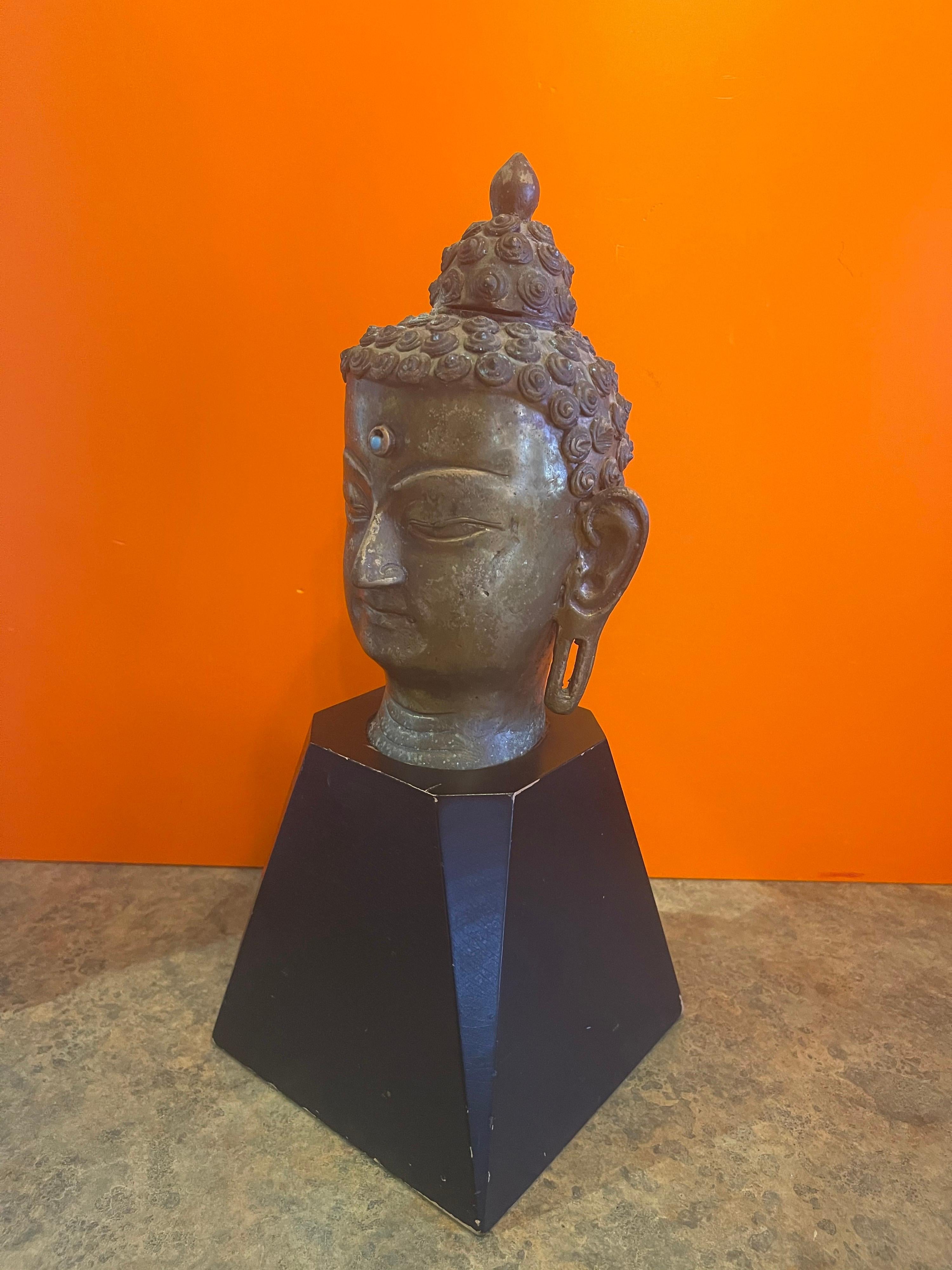 Cast Bronze Buddha Head on Wood Base For Sale