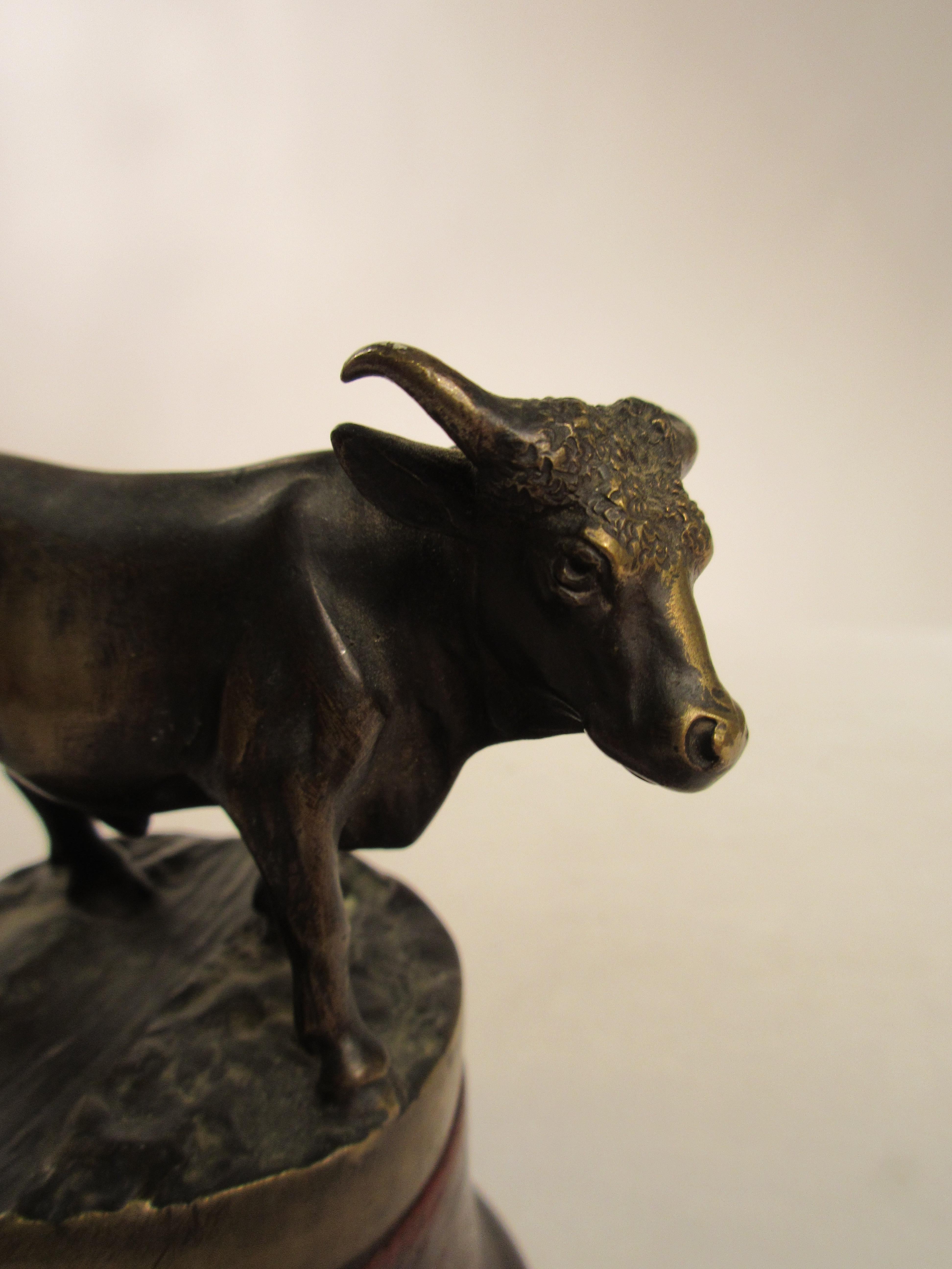 Bronze bull on wood base. Numbered. There are 2 available.