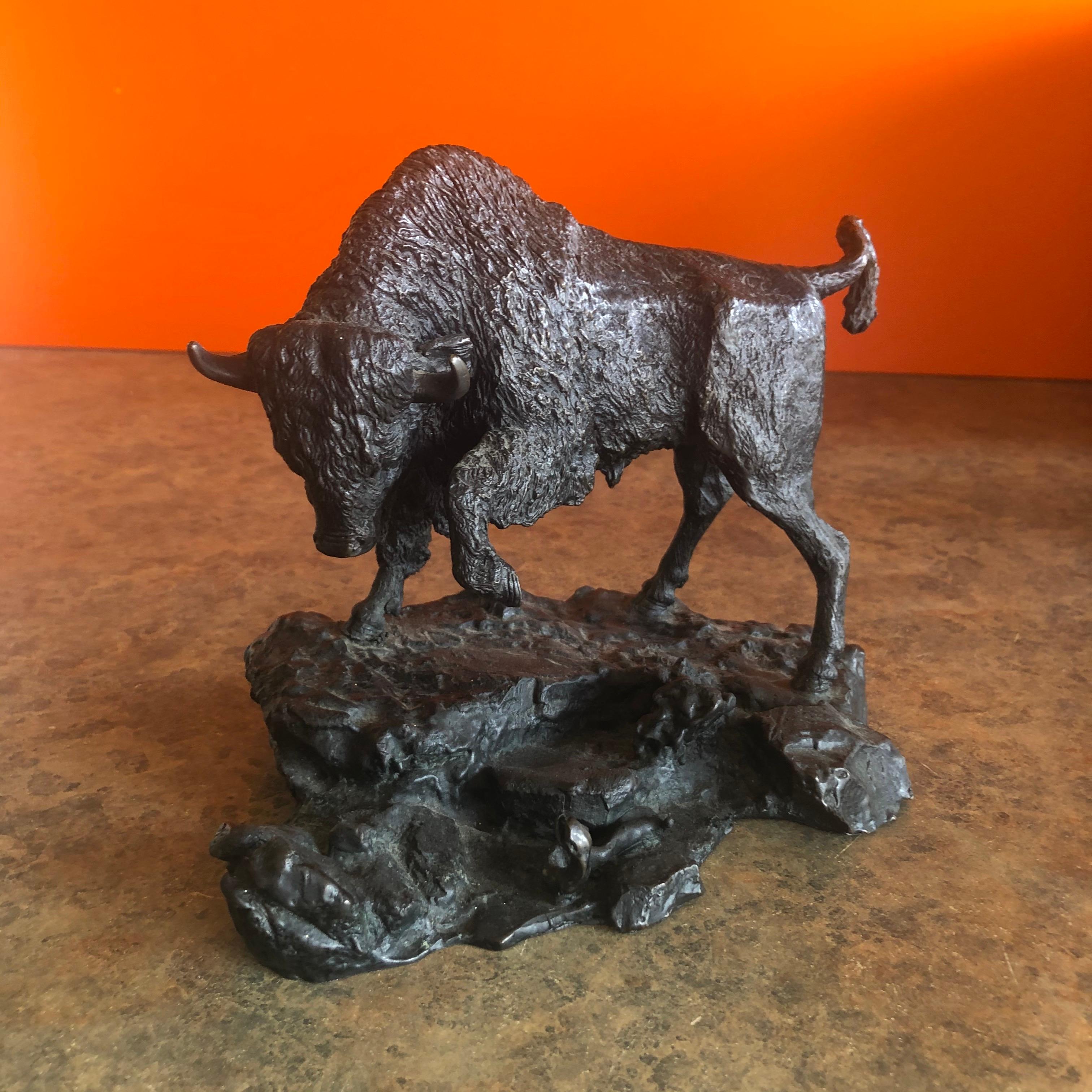Stunning bull and snake sculpture in cast bronze by listed sculptor Adam Rose, circa 1970s. The piece measures 6