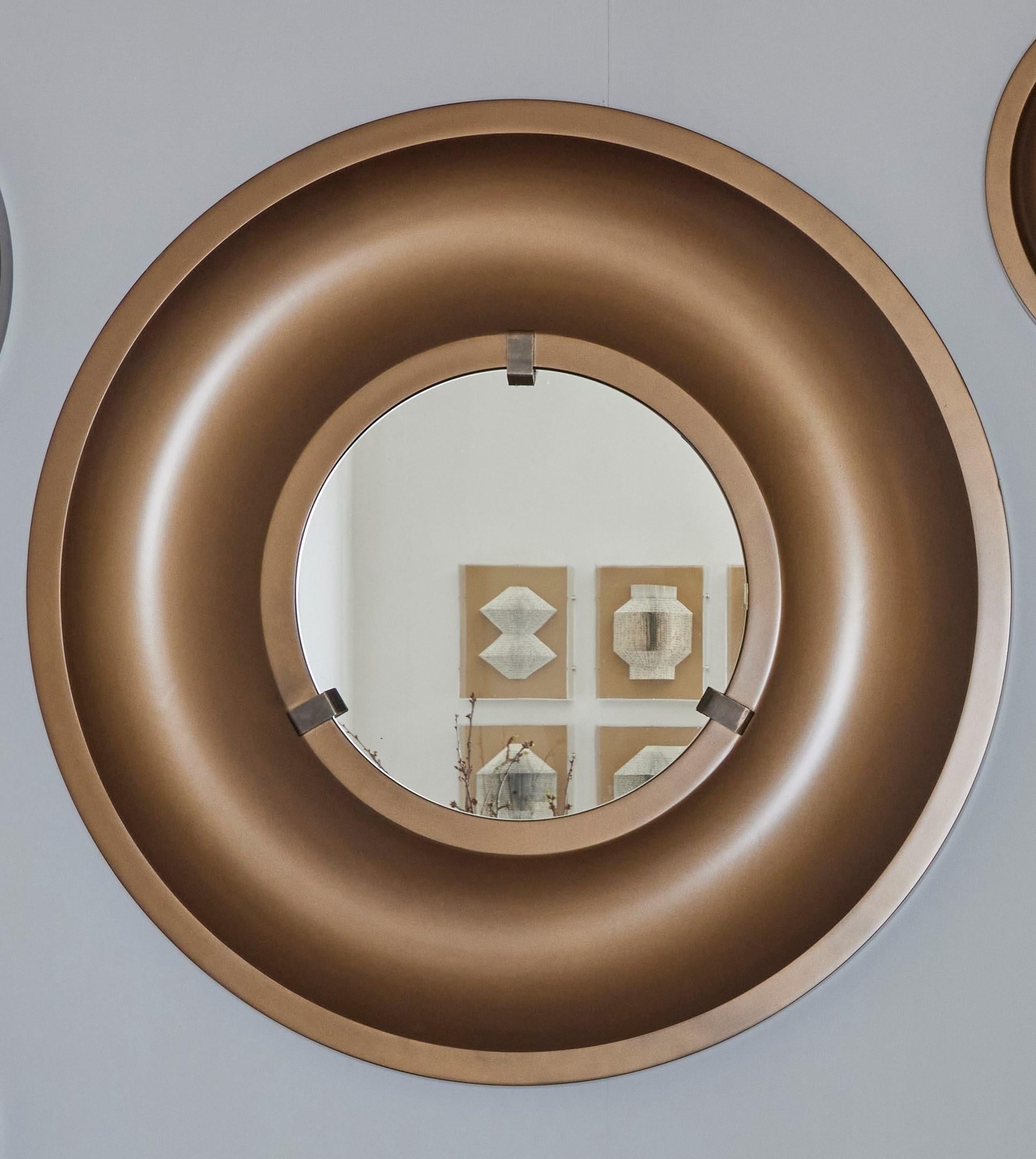 Our BULLSEYE MIRRORS do more than just reflect—they interpret. Each is cast in a rich bronze hue, differing in Size, and thus offers a distinct perspective. The mirrors sit within sleek wooden frames, a choice that pays homage to organic beauty